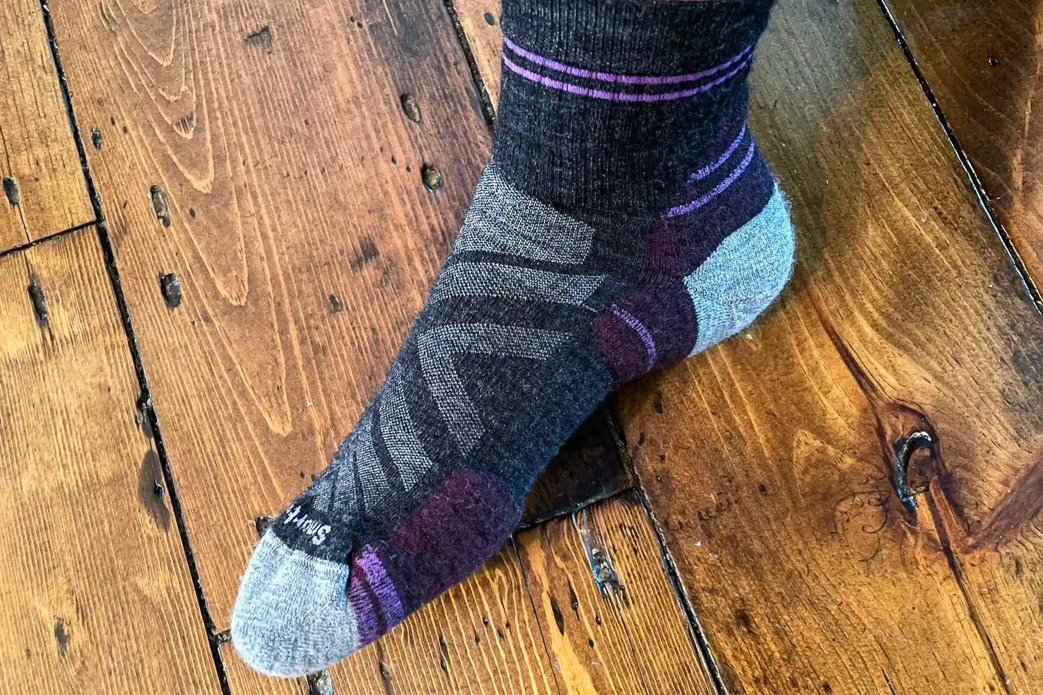 A side view if a person wearing the Smartwool Women's Hike Ankle Socks