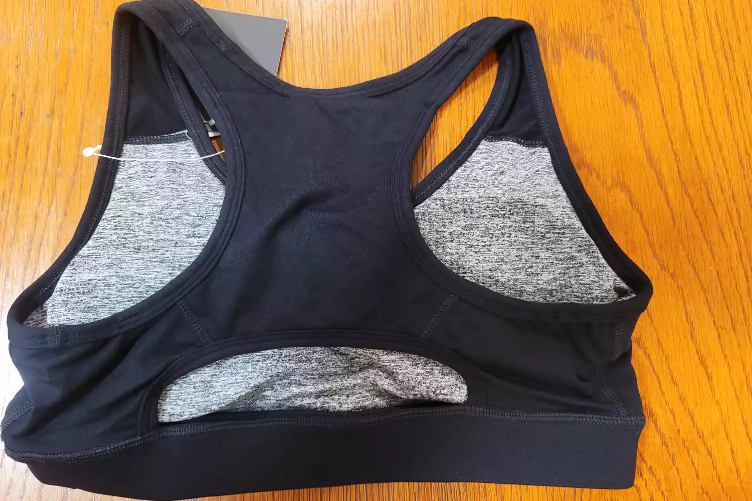 The Senita Sarah Sports Bra on a wooden surface