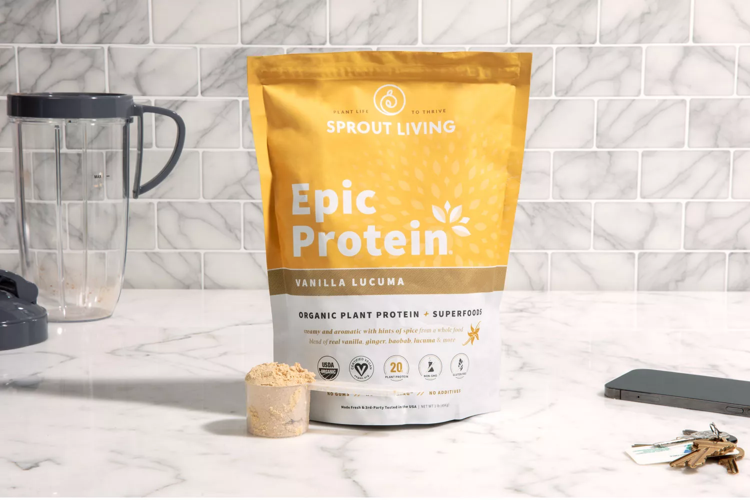 Sprout Living Epic Protein Vanilla Lucuma measured out on a marble counter 