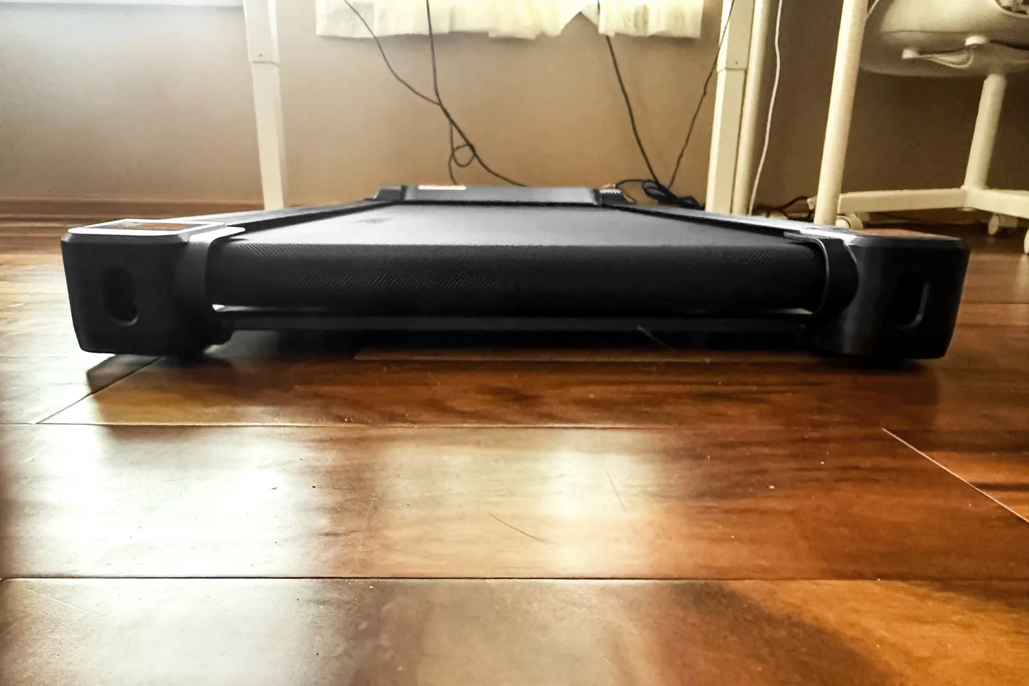 The back of the Sunny Health & Fitness Treadpad 100 Smart Wi-Fi Connected Treadmill