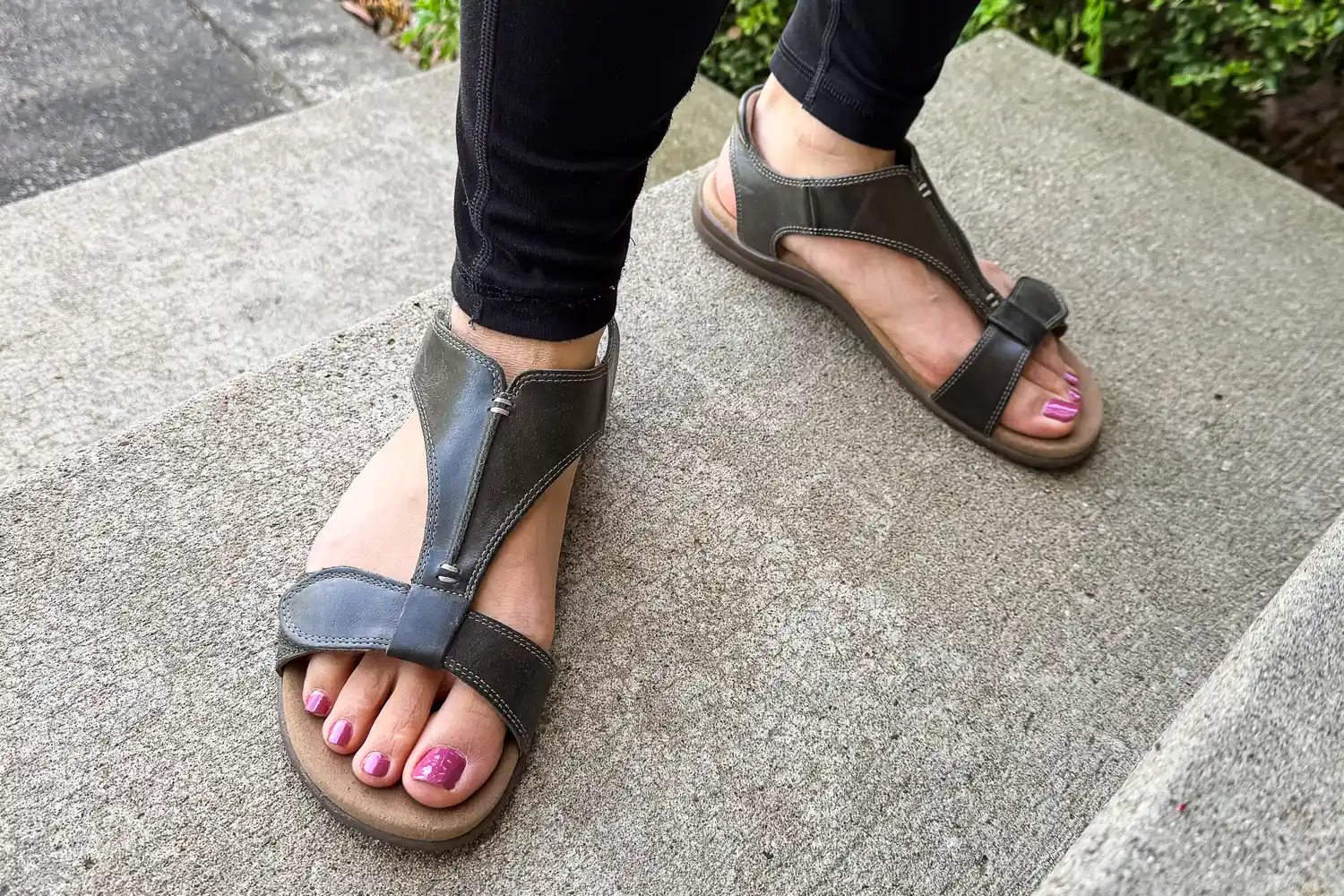A person wears a pair of Taos Women's The Show Sandals