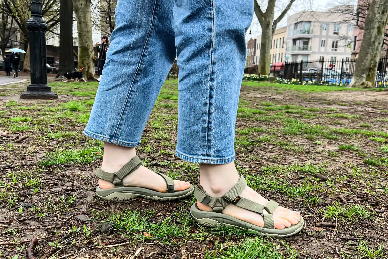 The side view of the Teva Women's Hurricane XLT2 sandals worn on dirt and grass