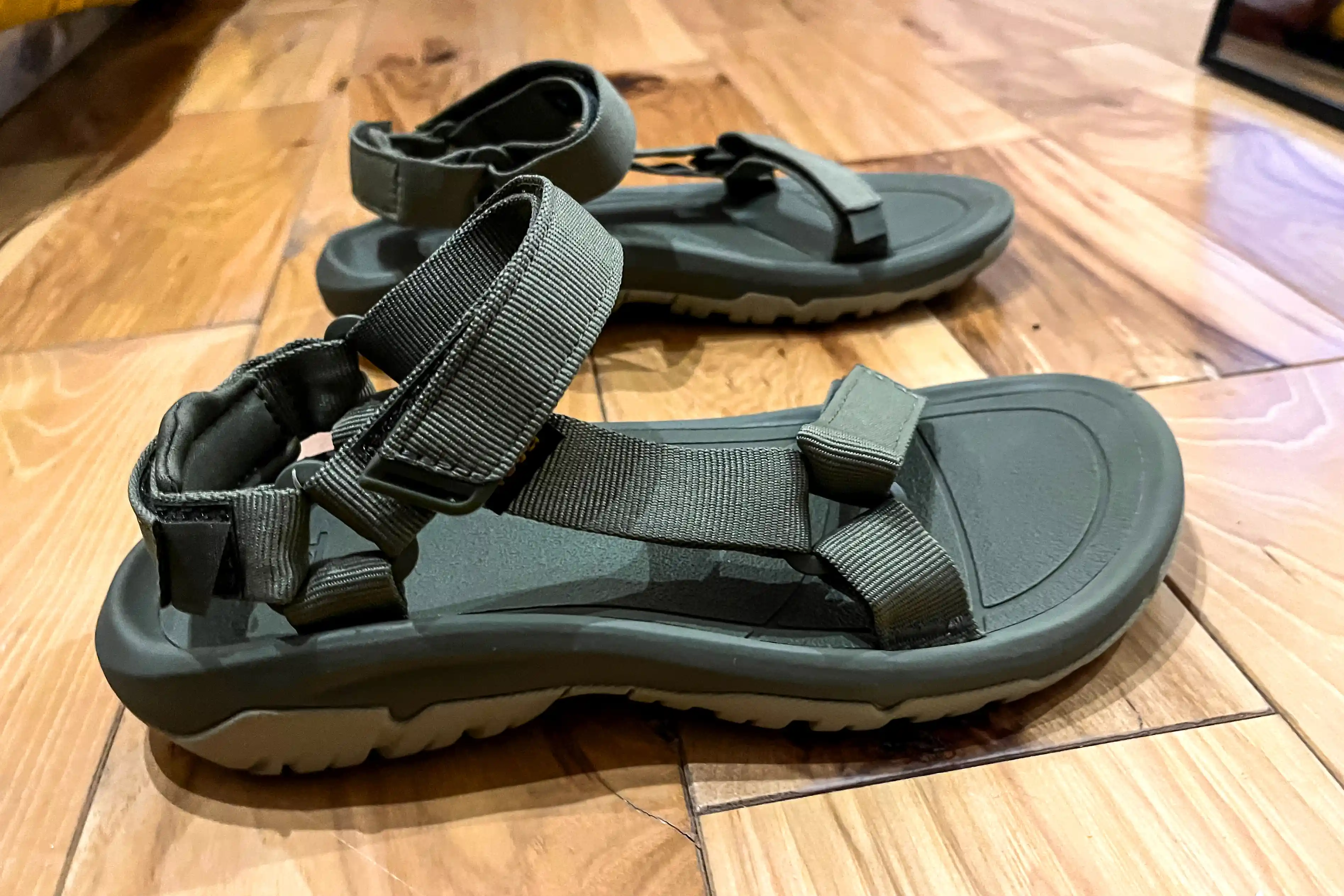 The side of the Teva Women's Hurricane XLT2 on a wooden floor