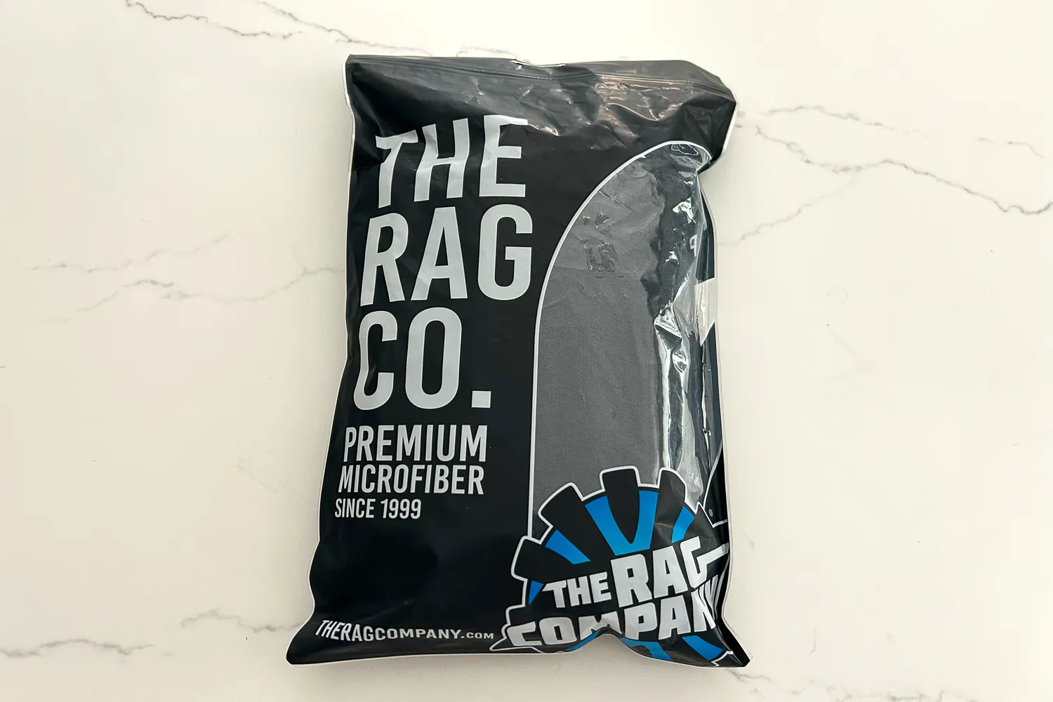 The The Rag Company Sport & Workout Towel inside plastic packaging