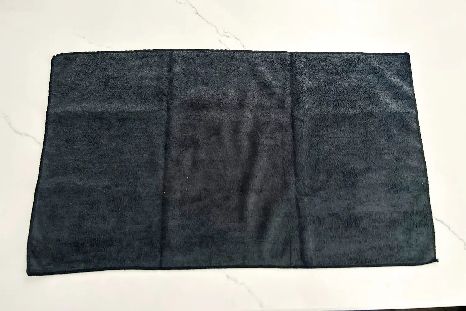 The The Rag Company Sport & Workout Towel full extended on a countertop