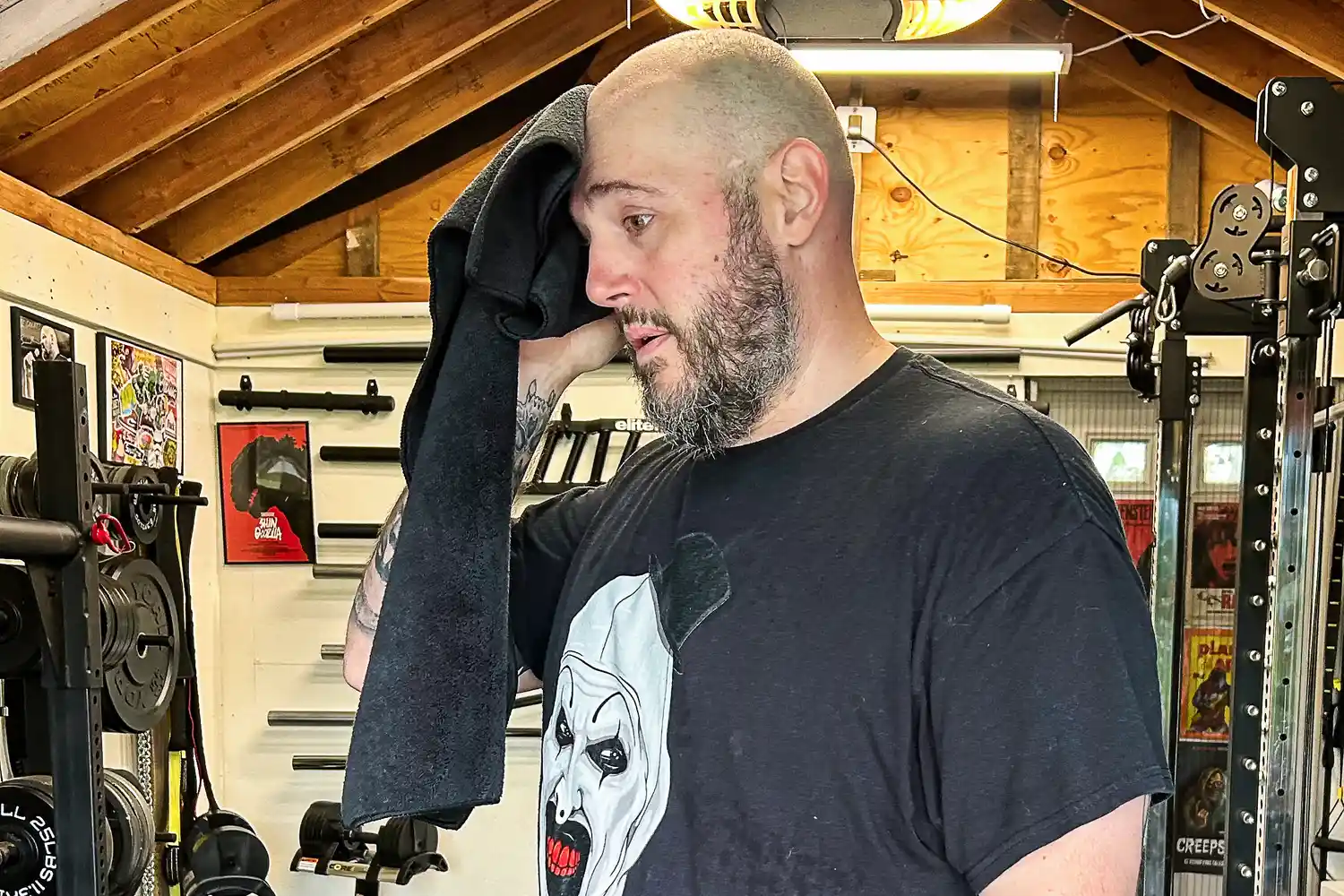 A person wipes their head with the The Rag Company Sport & Workout Towel