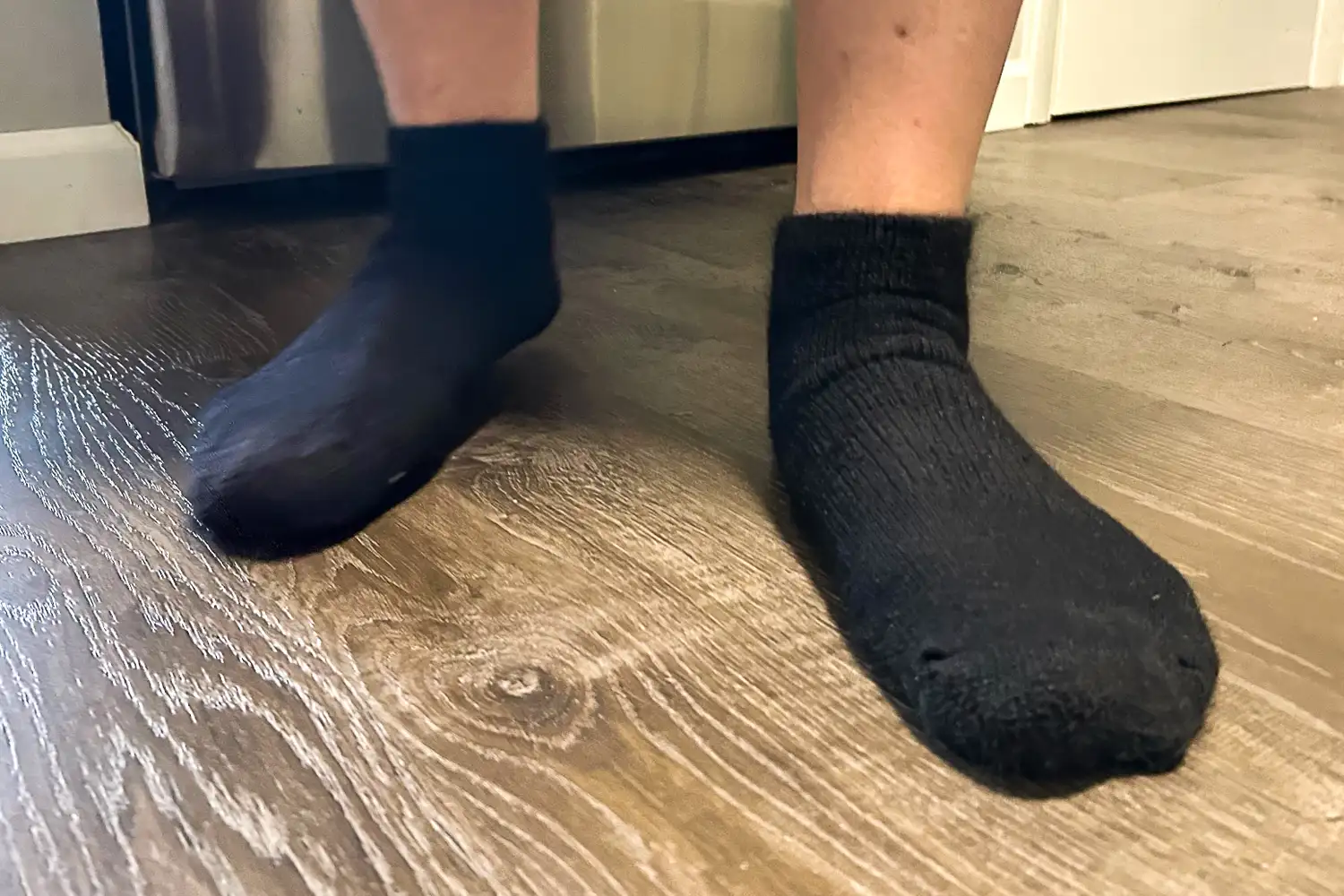 A front view of a person wearing the Thorlo WMX Moderate Cushion Ankle Walking Socks