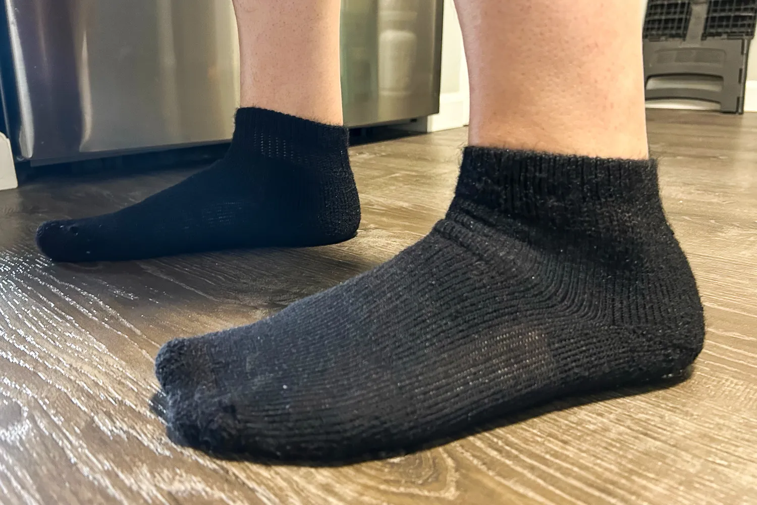 A side view of a person wearing the Thorlo WMX Moderate Cushion Ankle Walking Socks