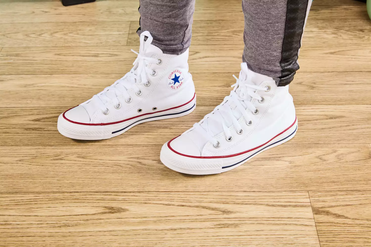 Person wearing Converse Chuck Taylor All Star Sneakers