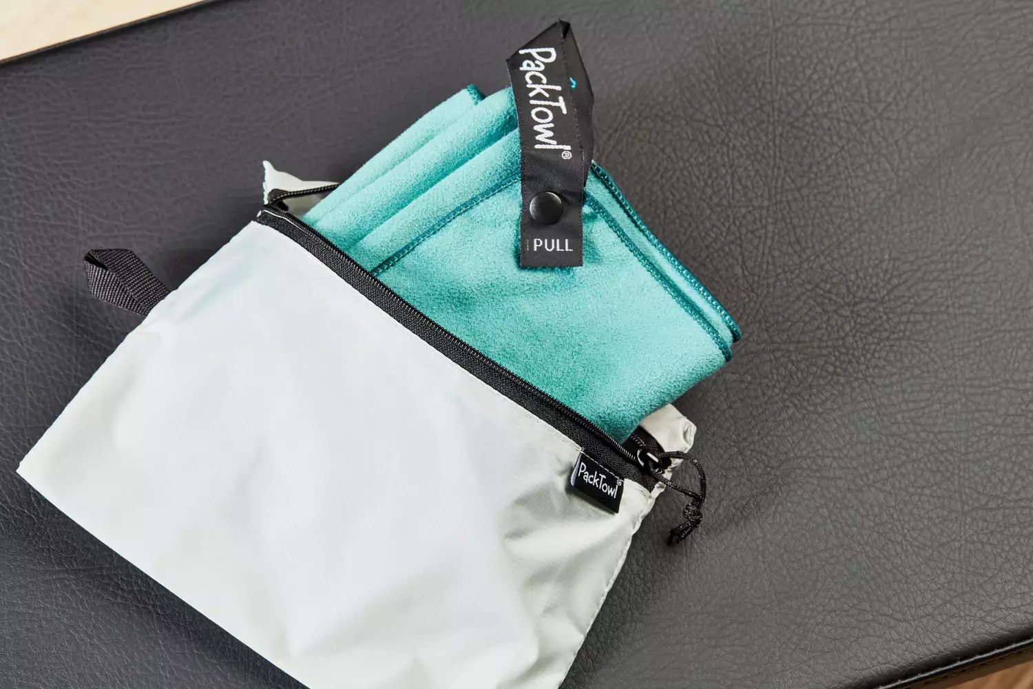 close up of Packtowel microfiber towel packed into bag