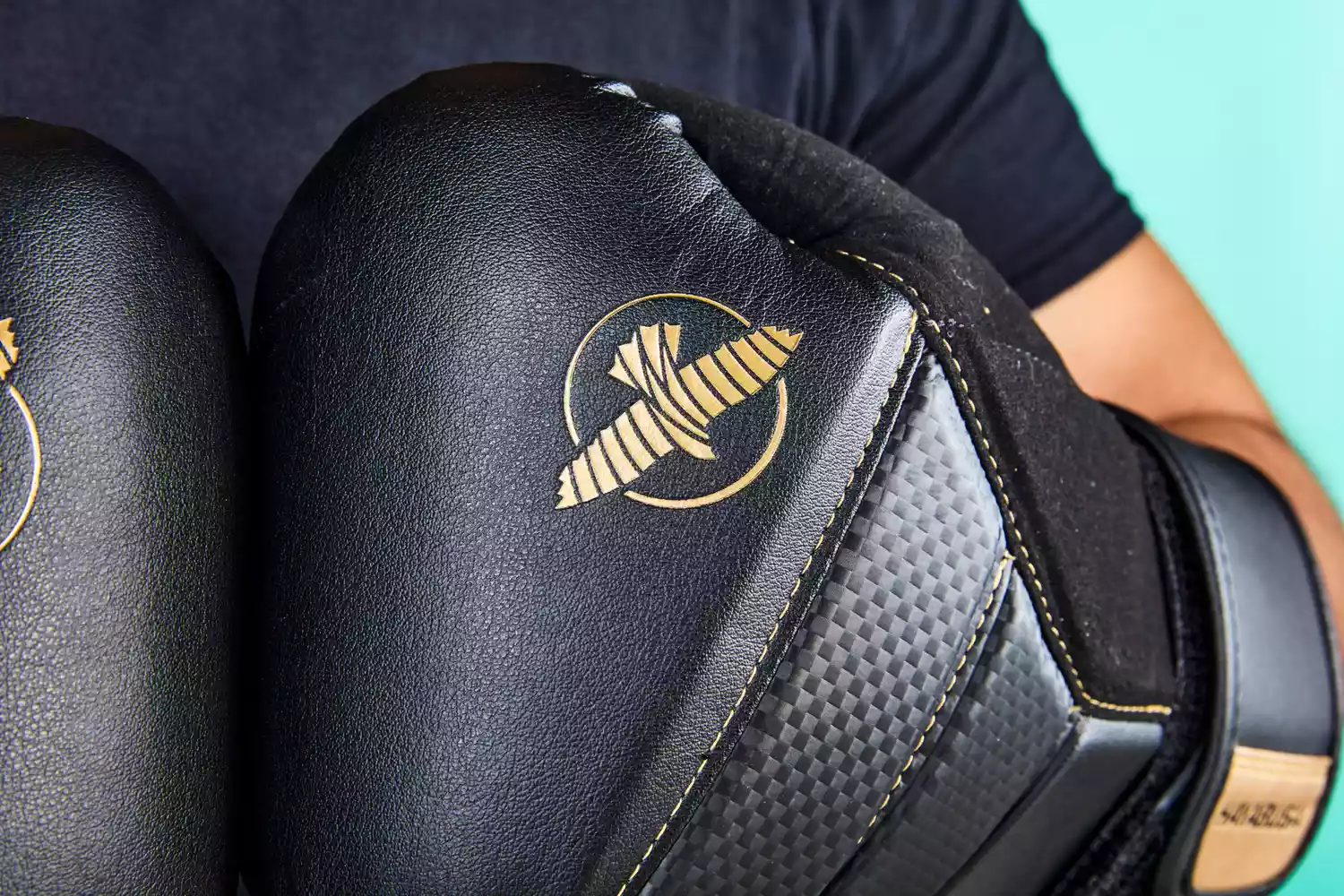 A closeup of a person wearing Hayabusa T3 Boxing Gloves