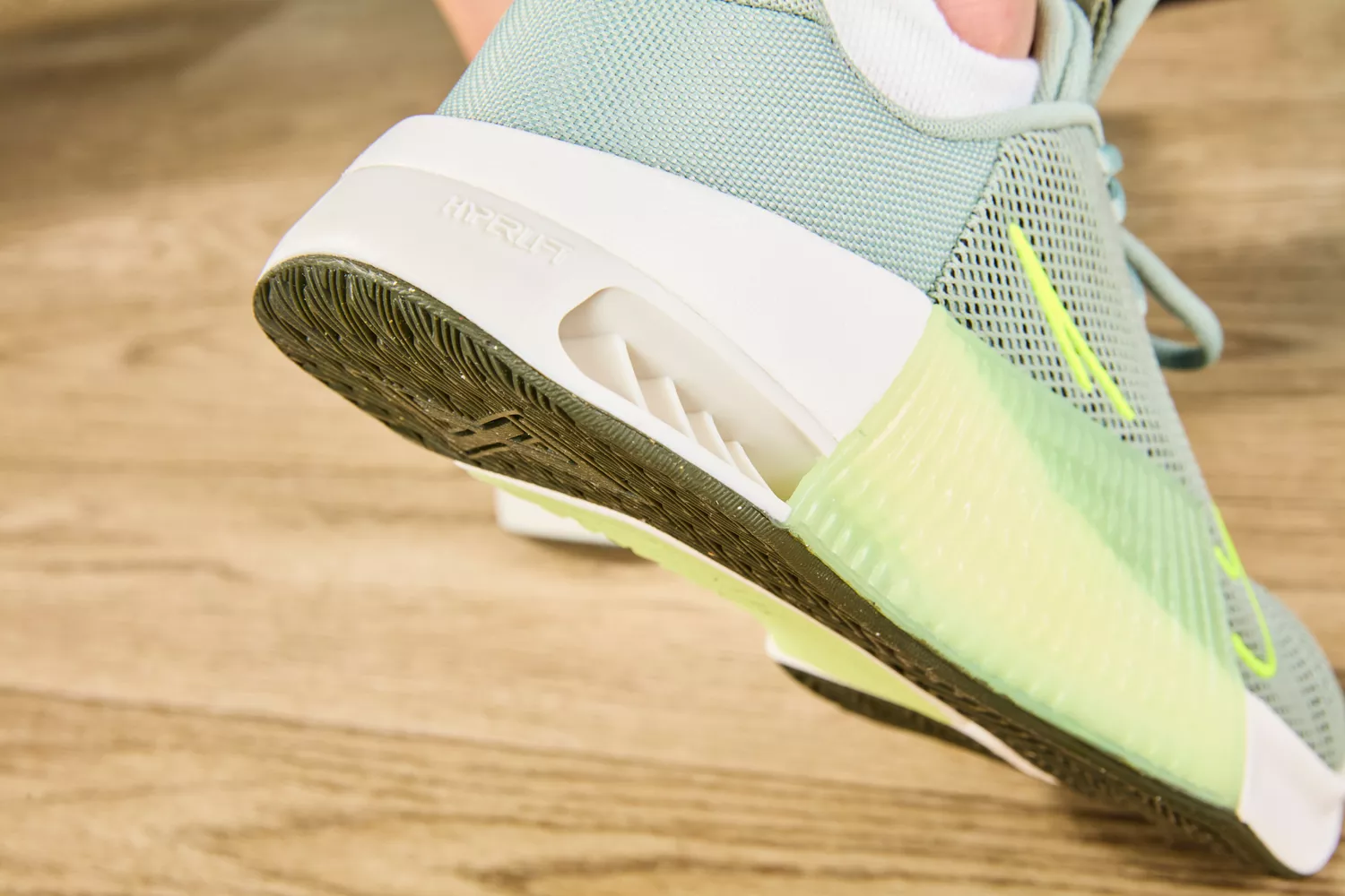 Person lifting heel of Nike Women's Metcon 9 