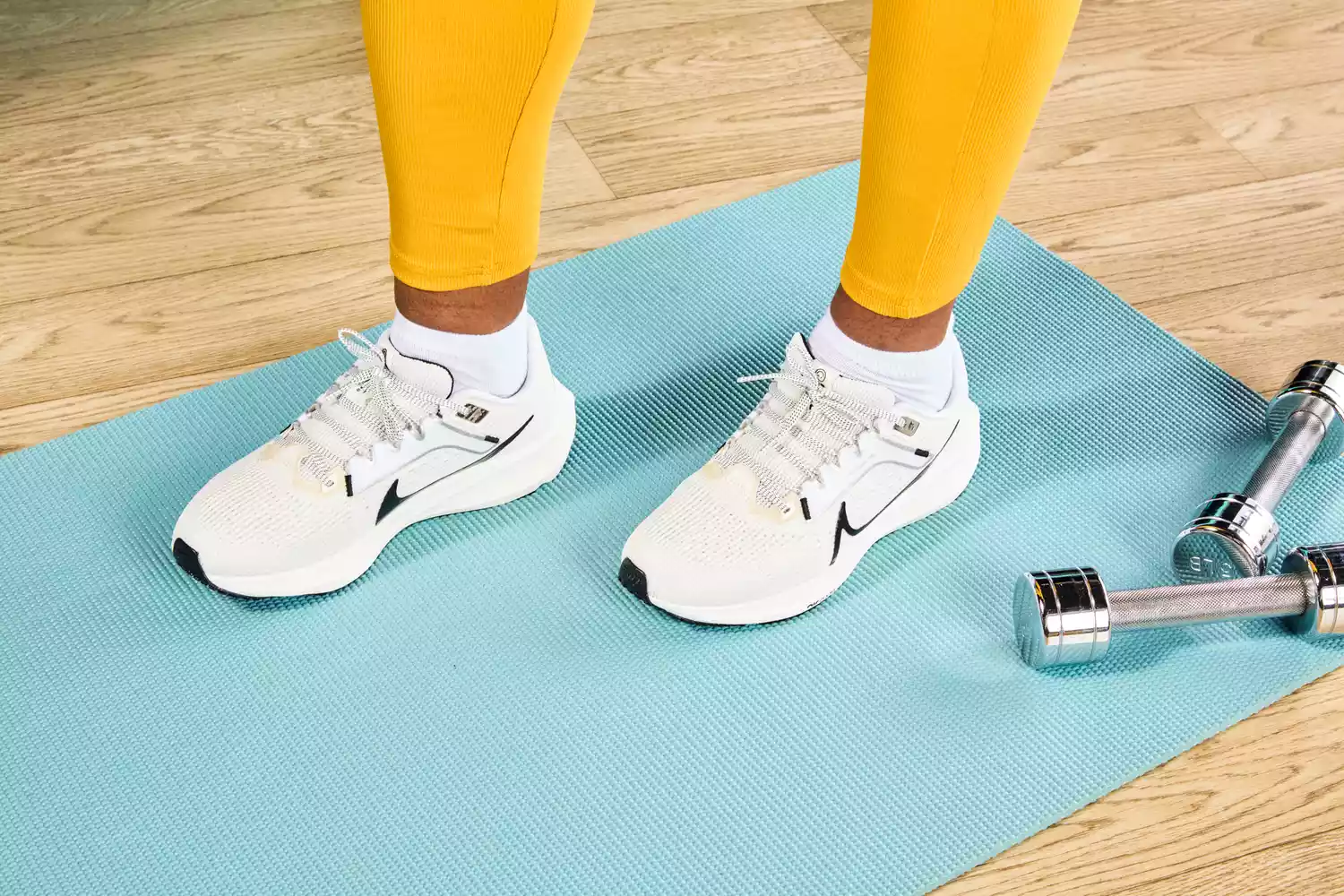 Person standing wearing Nike Womenâs Pegasus 40