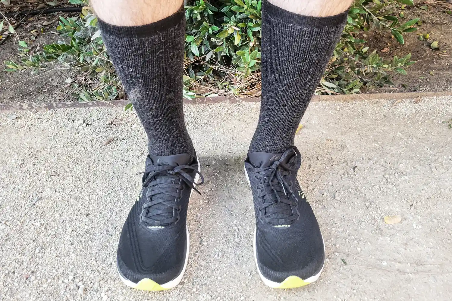 A front view of a person wearing the Topo Athletic Men's Cyclone 3 Road Running Shoes