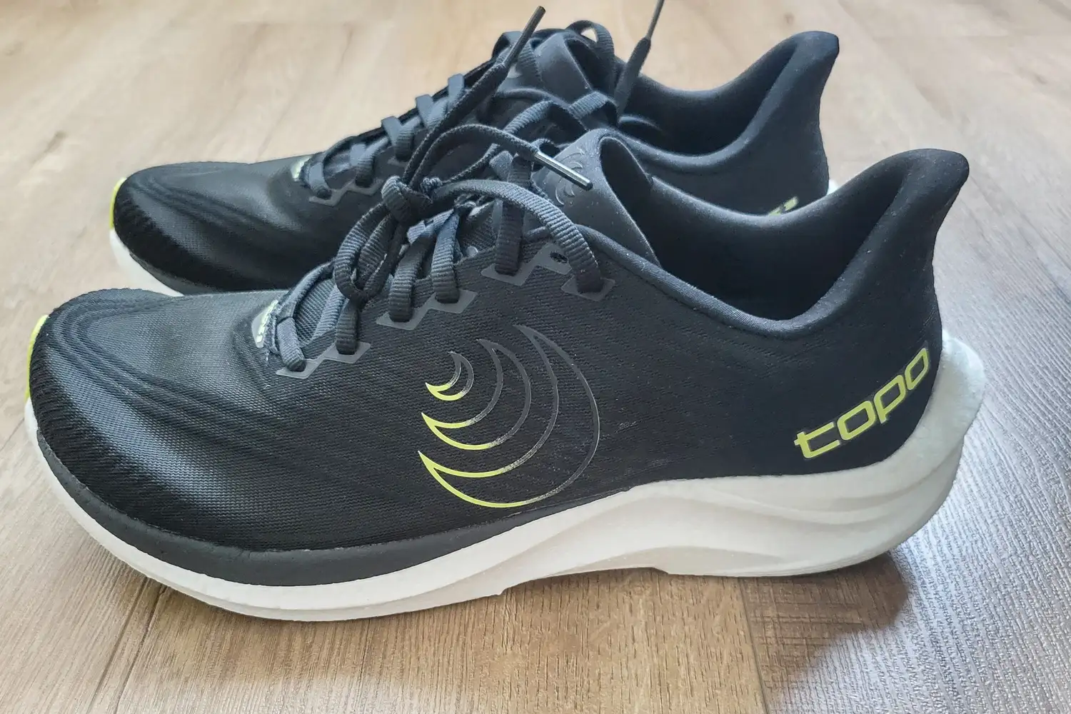 A side view of a pair of Topo Athletic Men's Cyclone 3 Road Running Shoes