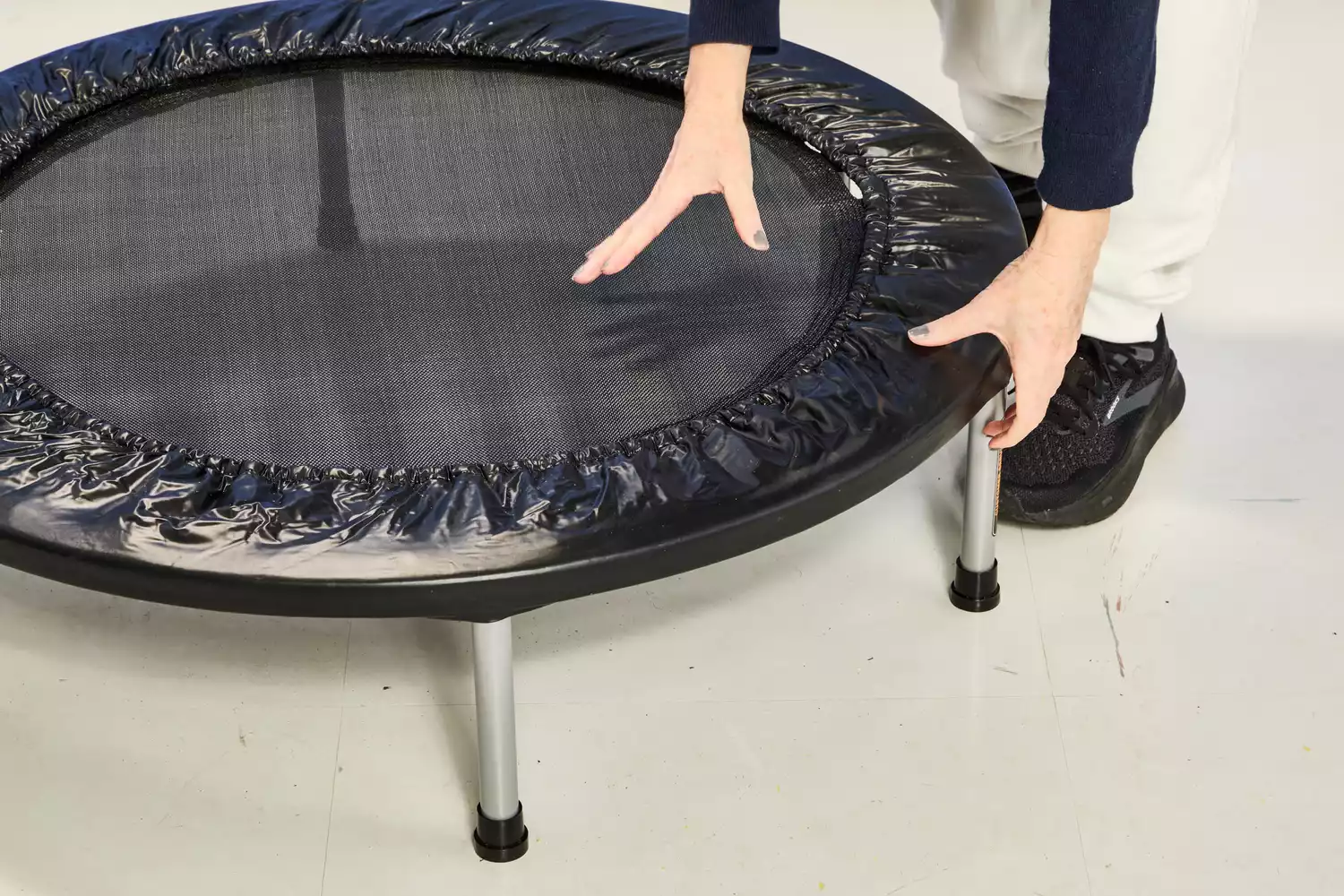A person pressing their hands into the Fitness Gear Mini Trampoline