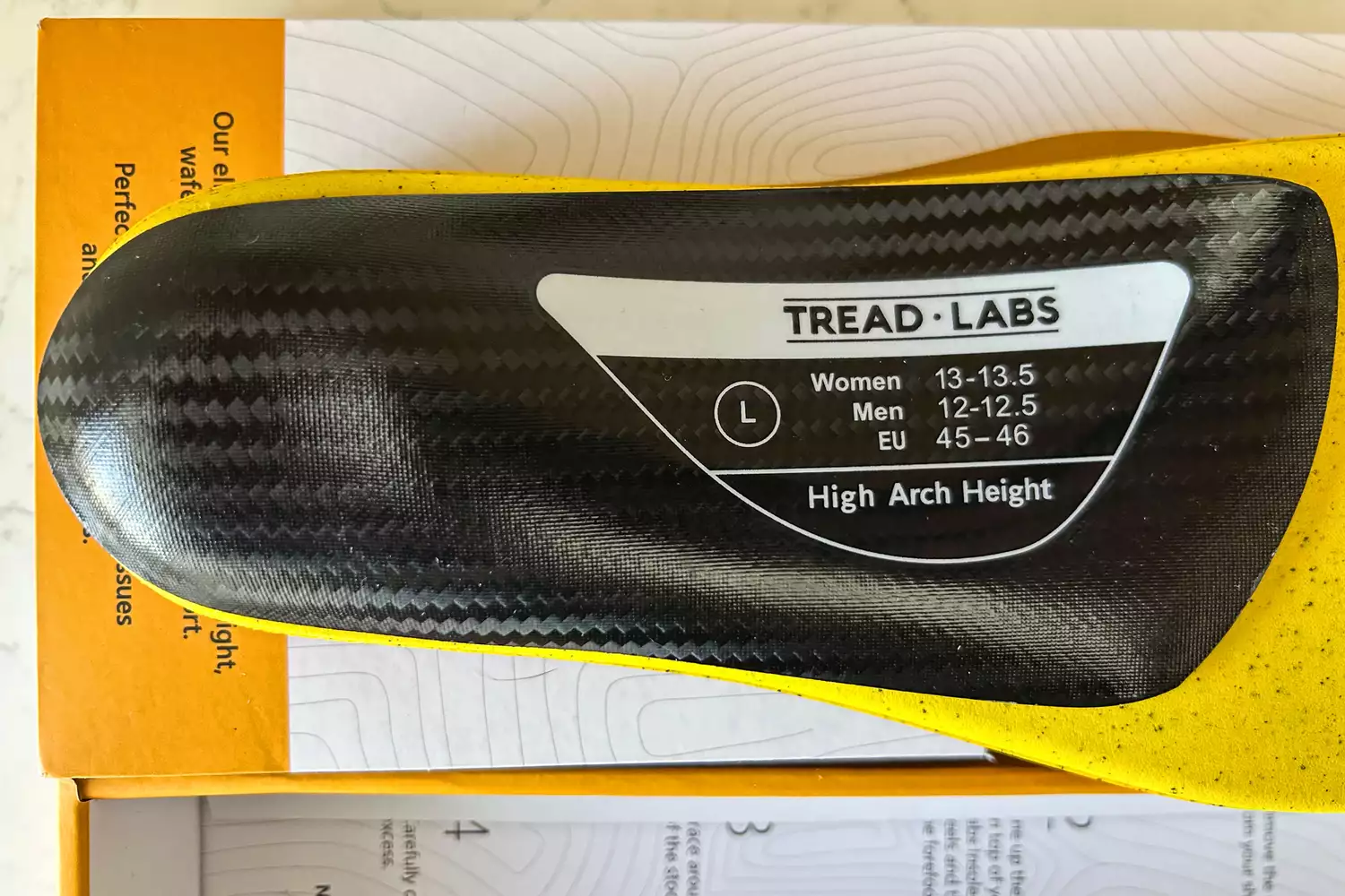 The product information printed on the bottom of the Tread Labs Dash Insole
