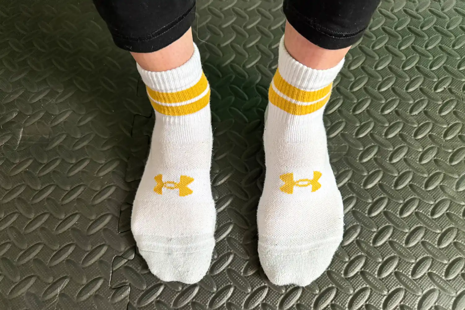An overhead view of a person wearing the Under Armour UA Performance Tech Socks
