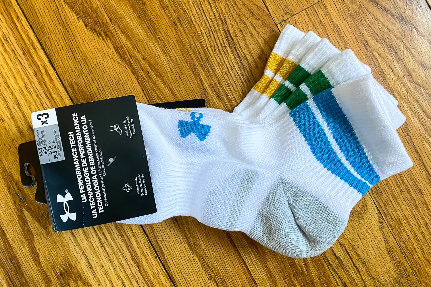 Three pairs of Under Armour UA Performance Tech Socks in packaging