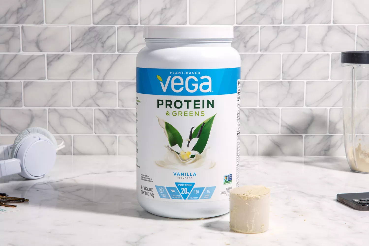 Vega Protein & Greens Plant-Based Protein Powder sitting on counter