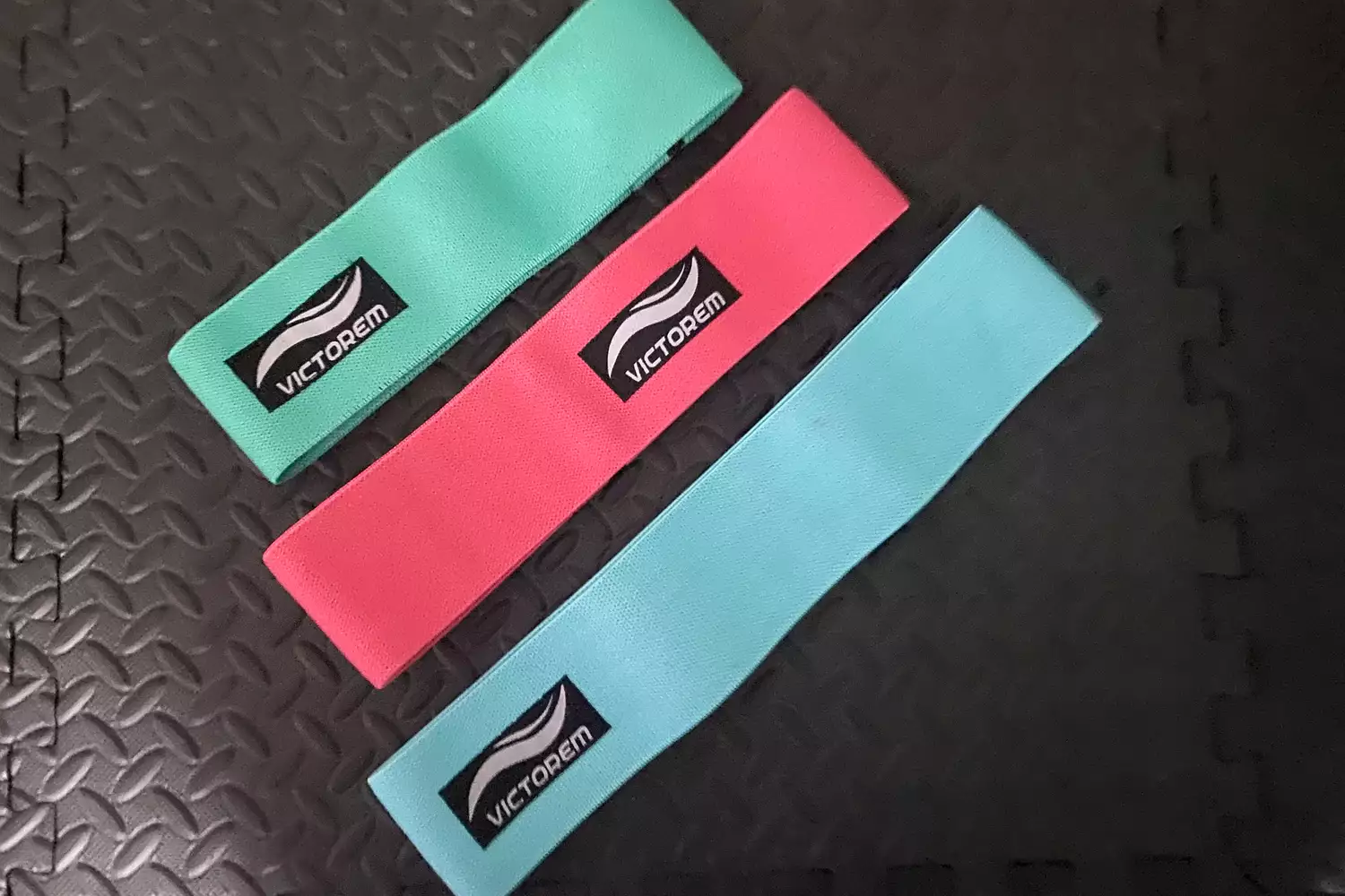 Three Victorem Resistance Hip Booty Bands on a black background