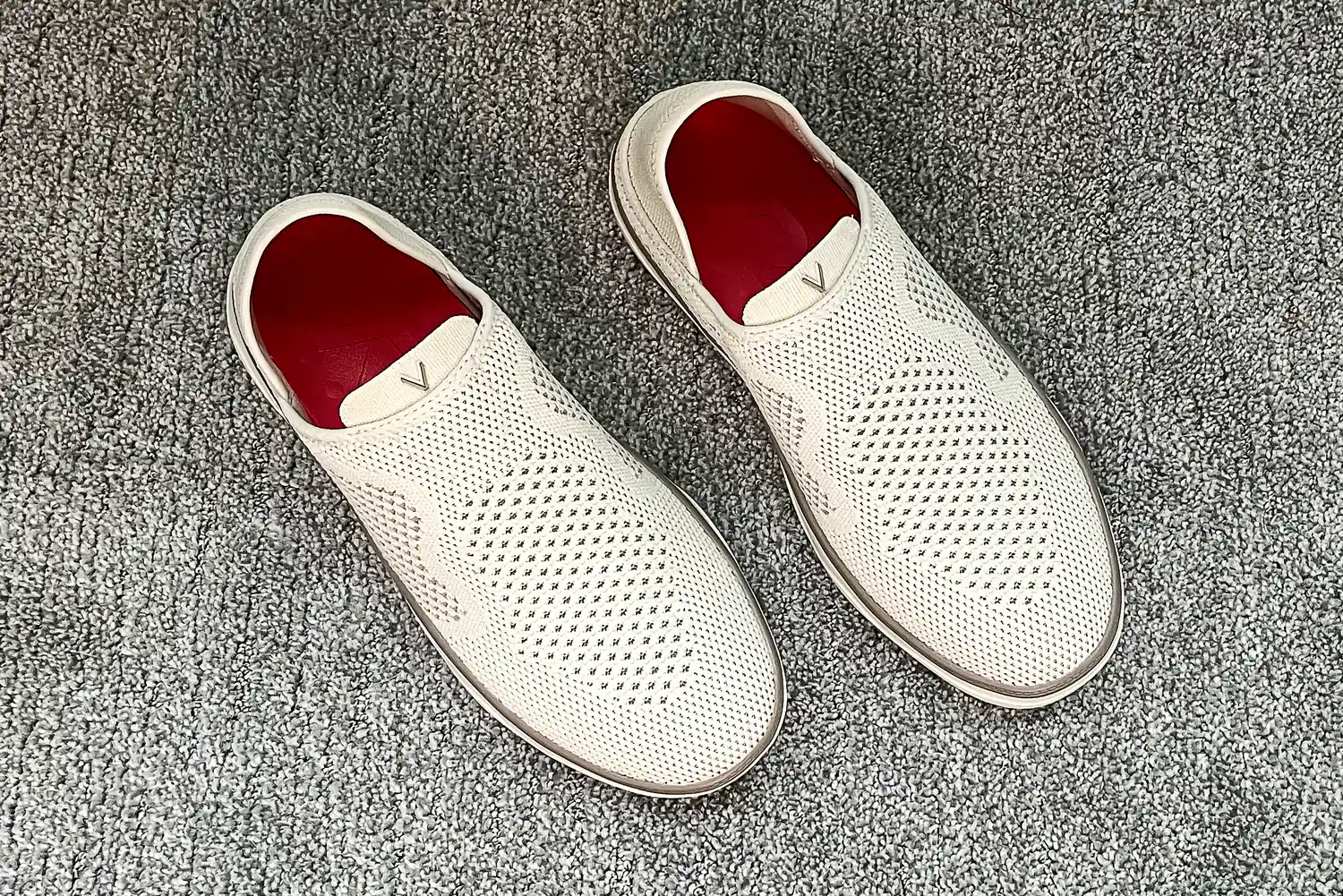 A pair of Vionic Women's Sage RX Recovery Slip-On Shoes on carpet