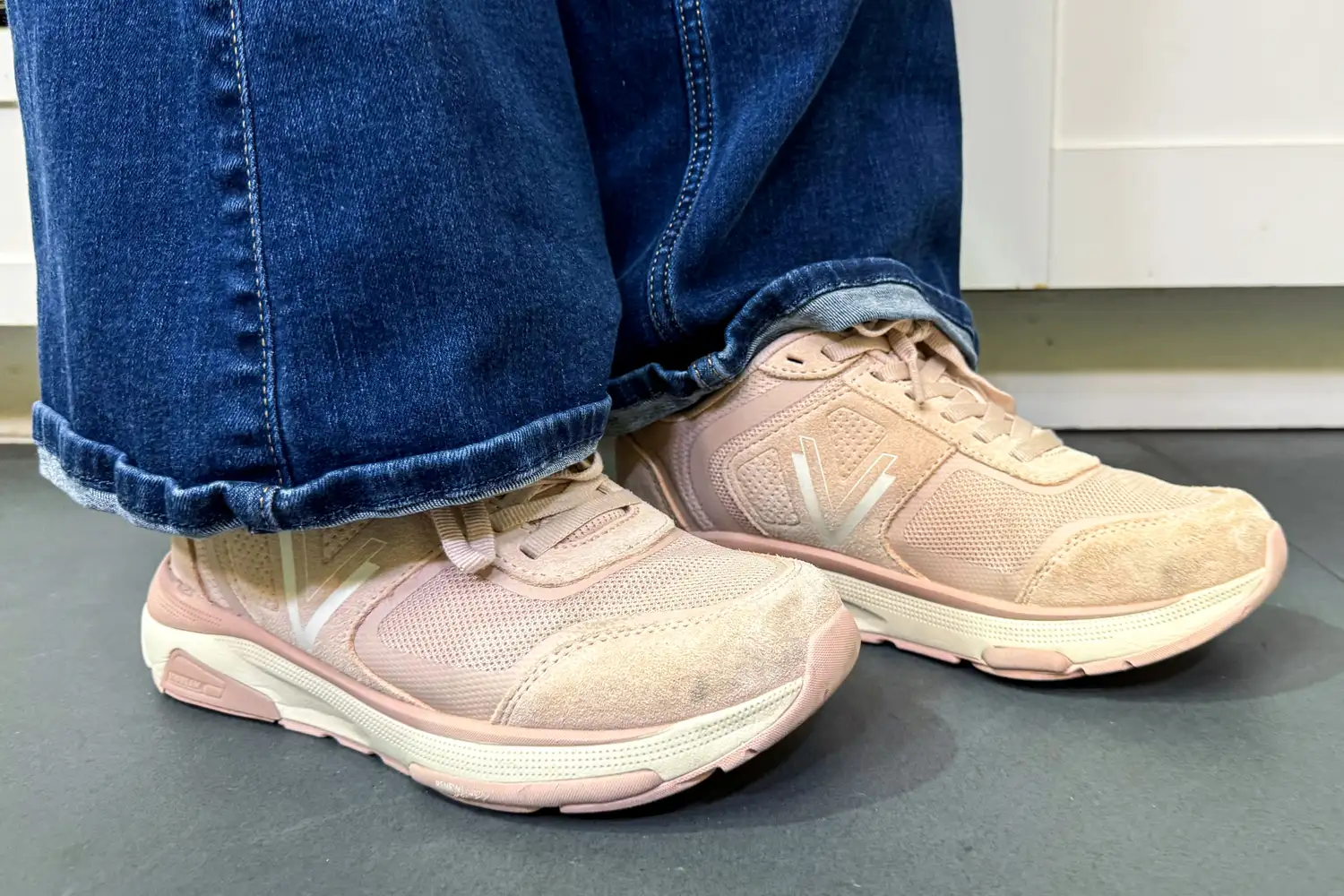 A close-up of a person wearing the Vionic Women's Walk Strider Sneakers