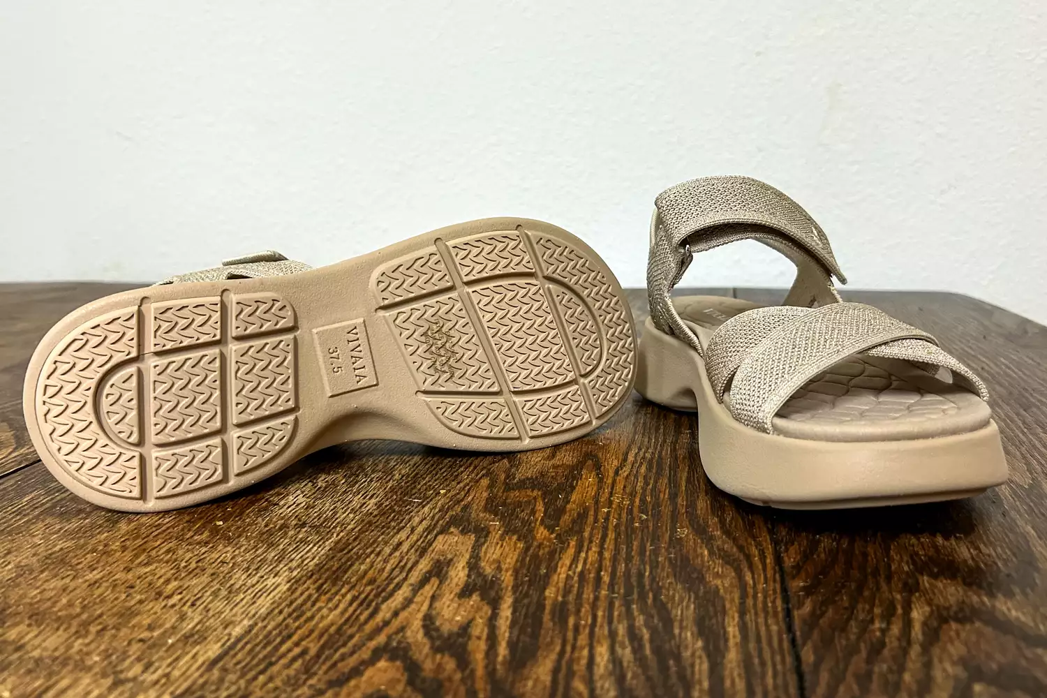 The Vivaia Kiara Sport Sandals posed on wood