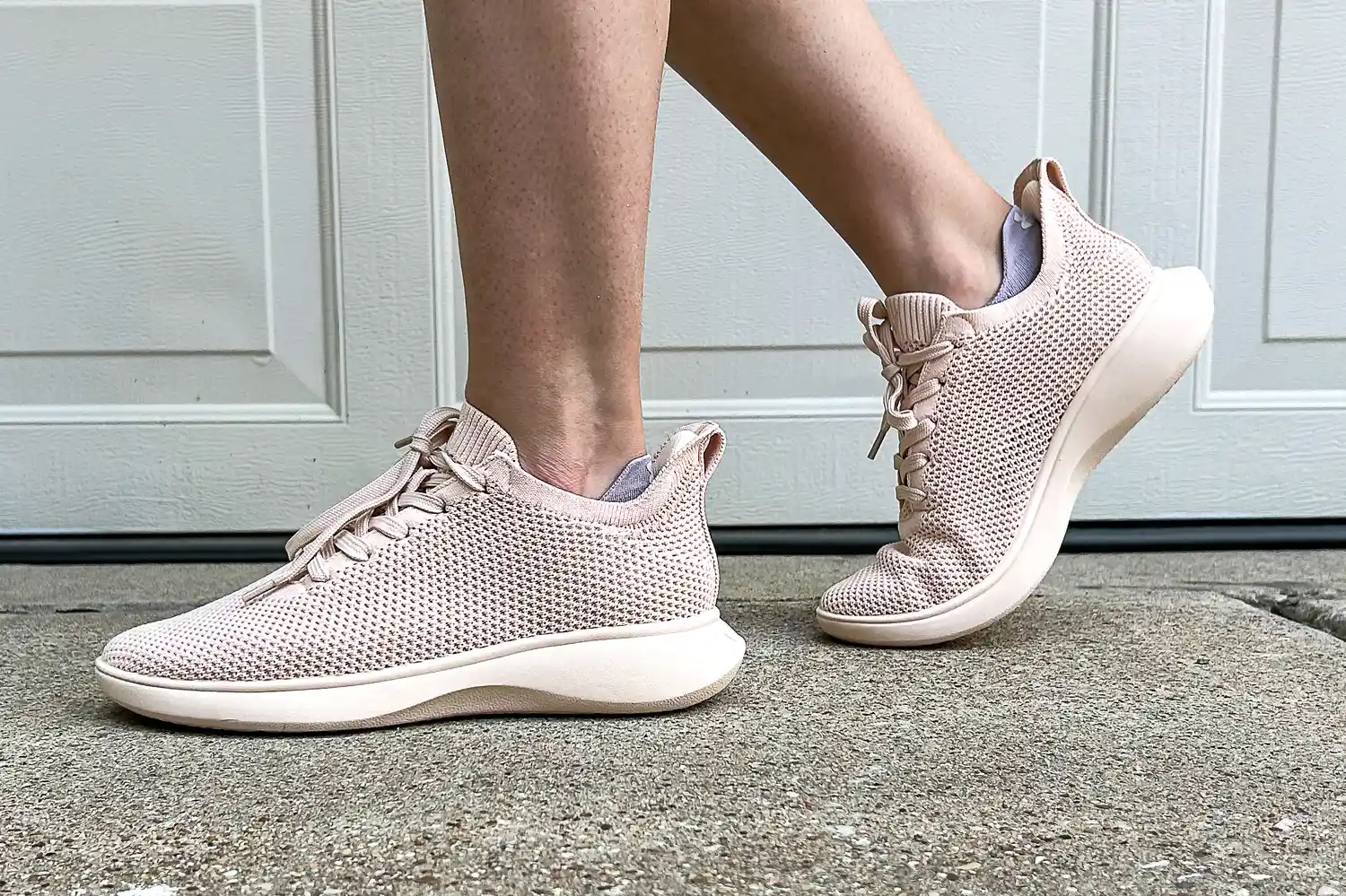 A person walks outside while wearing the Vivaia Unisex Urban Sneaker Sliders