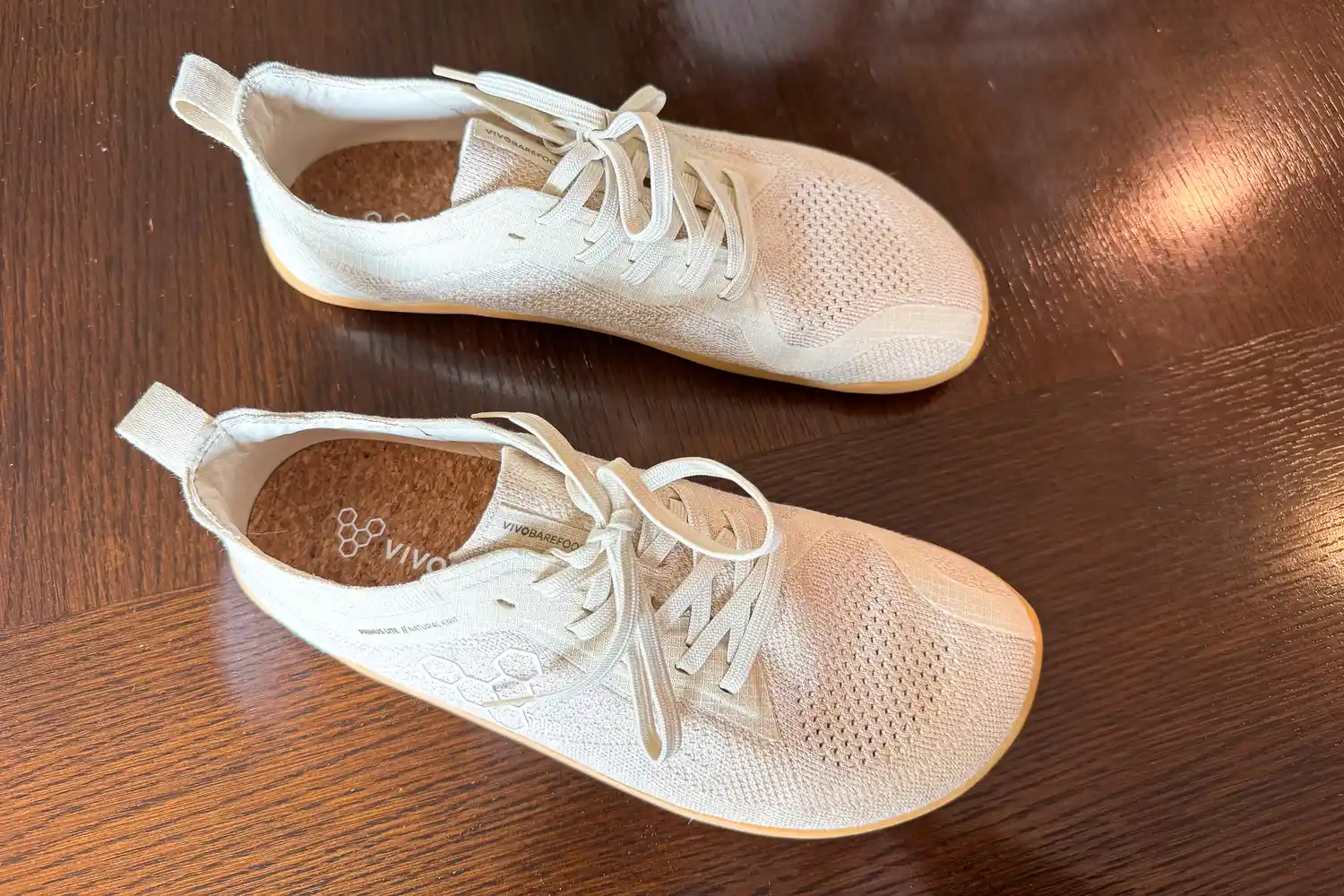 An overhead view of a pair of Vivobarefoot Women's Primus Lite Knit Natural Sneakers