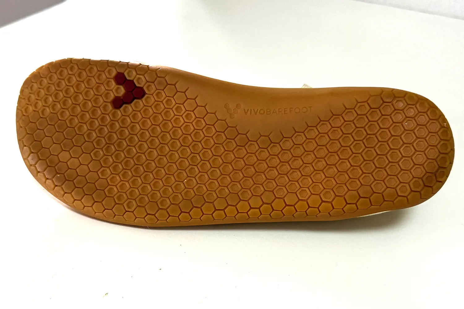 The treads on the bottom of the Vivobarefoot Women's Primus Lite Knit Natural Sneakers