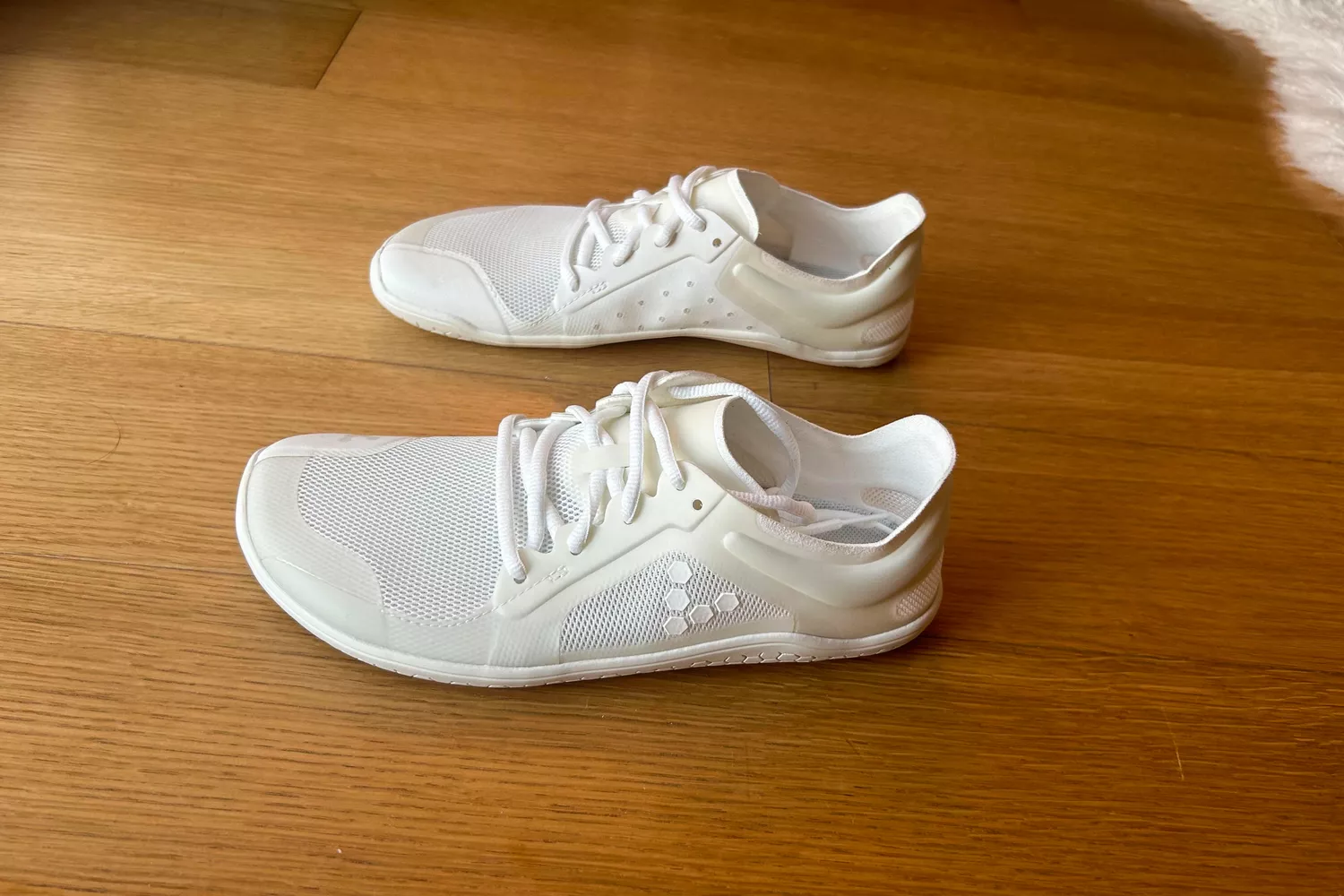 A side view of the Vivobarefoot Women's Primus Lite III Weightlifting Sneakers