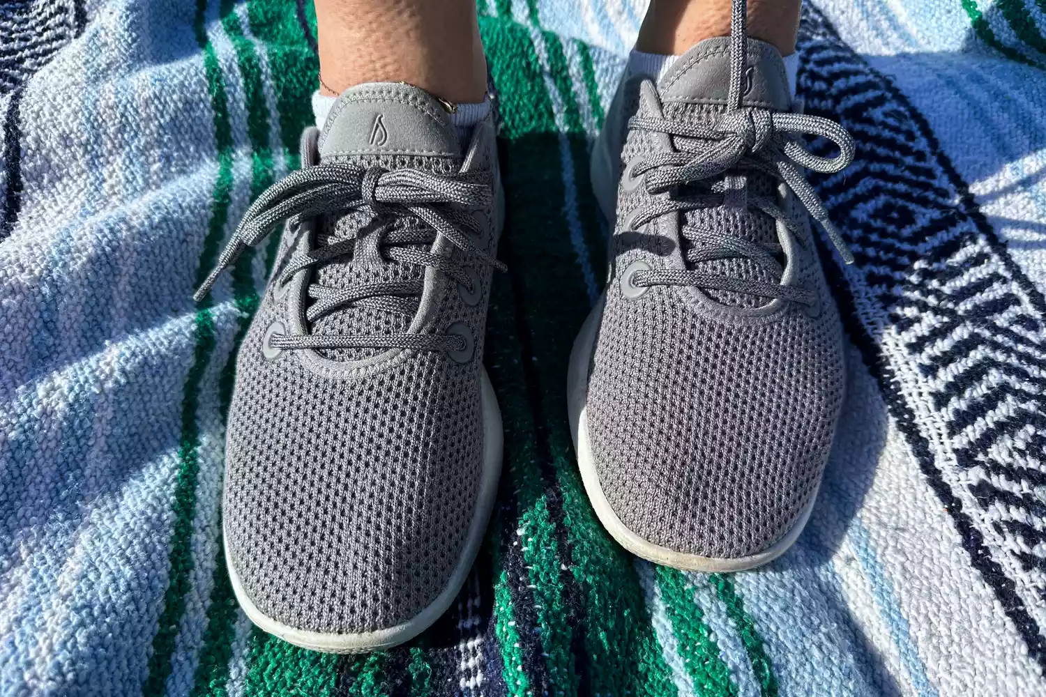 The Allbirds Tree Runners worn on a towel