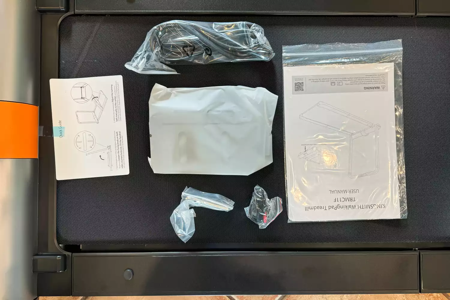 The WalkingPad MC11 Workout Treadmill manual and accessories