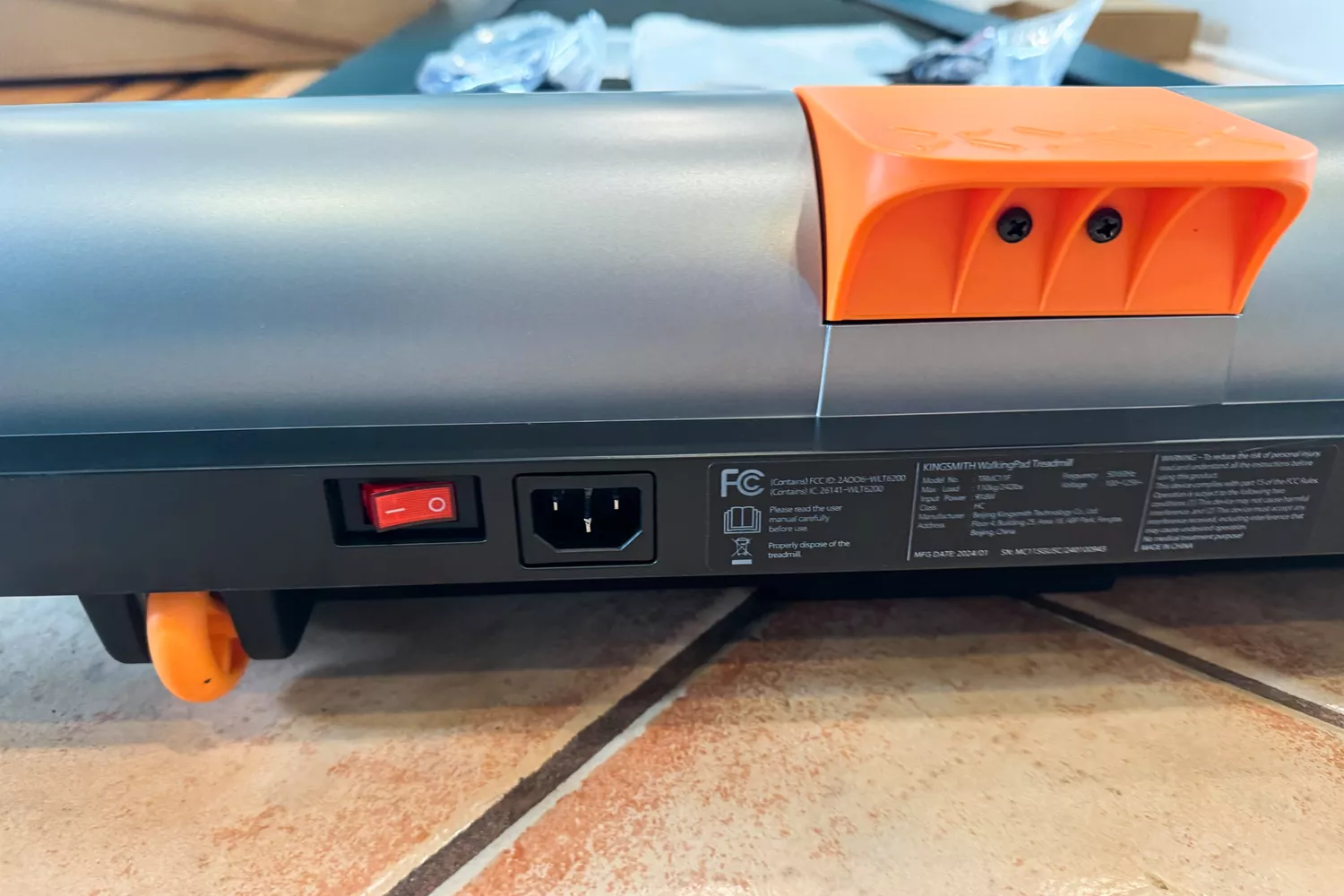 A close-up of power button and warning instruction of WalkingPad MC11 Workout Treadmill