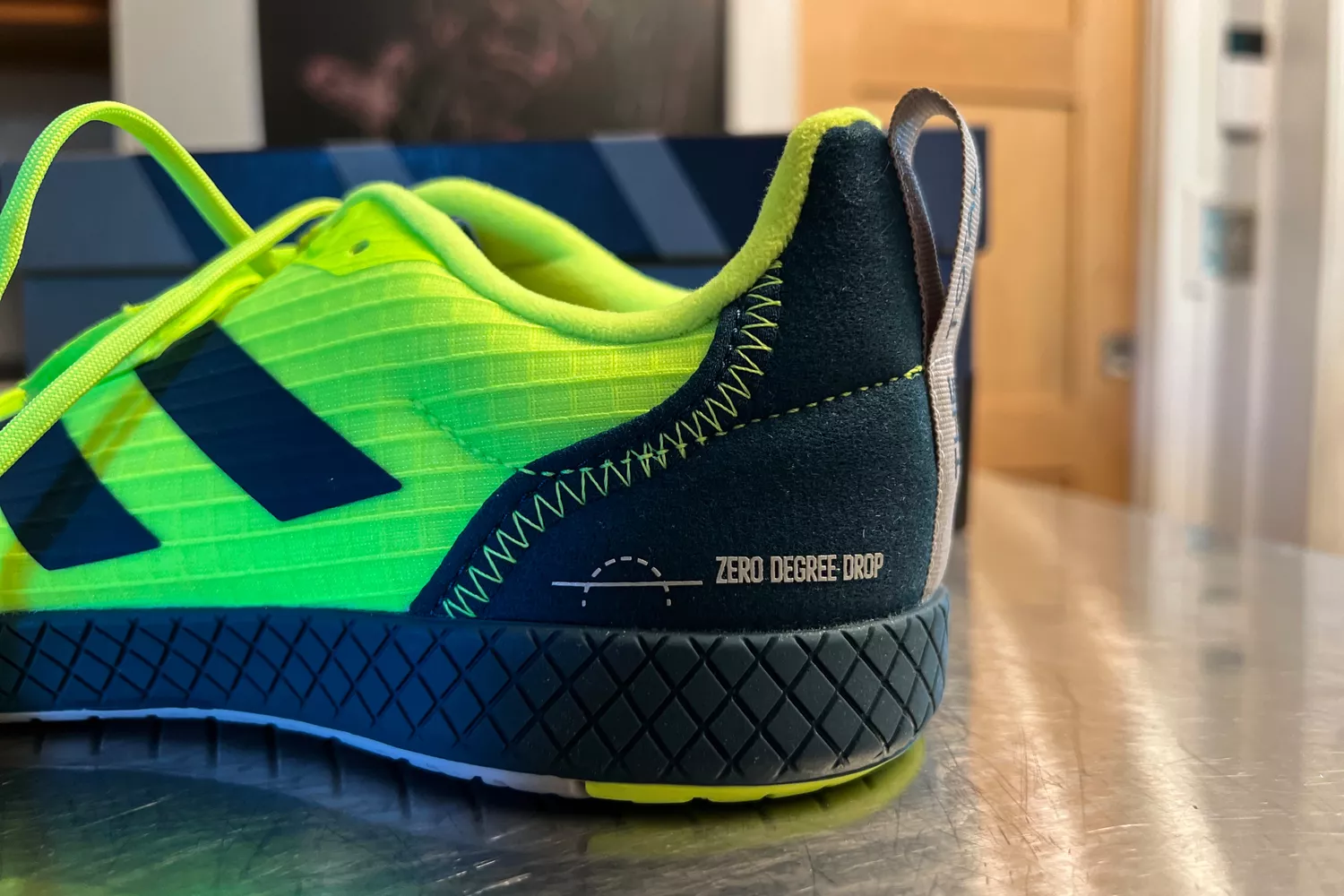 A closeup of the stitching on the side of the adidas The Total Shoes Unisex Weightlifting Sneakers