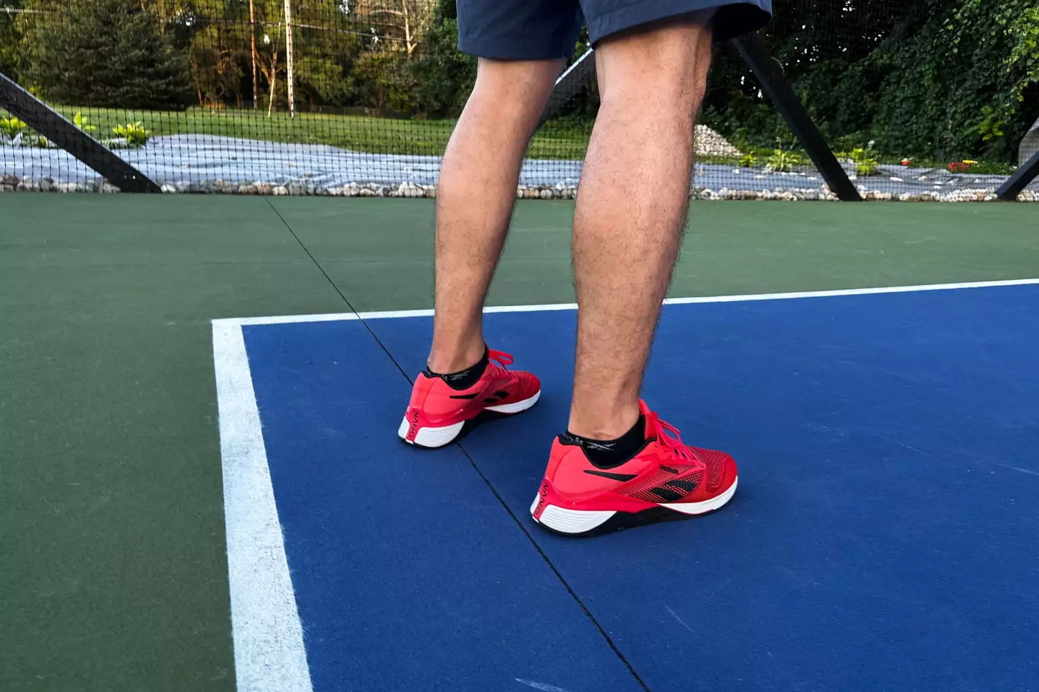 The back of a person wearing the Reebok Unisex Nano X4 Training Shoes