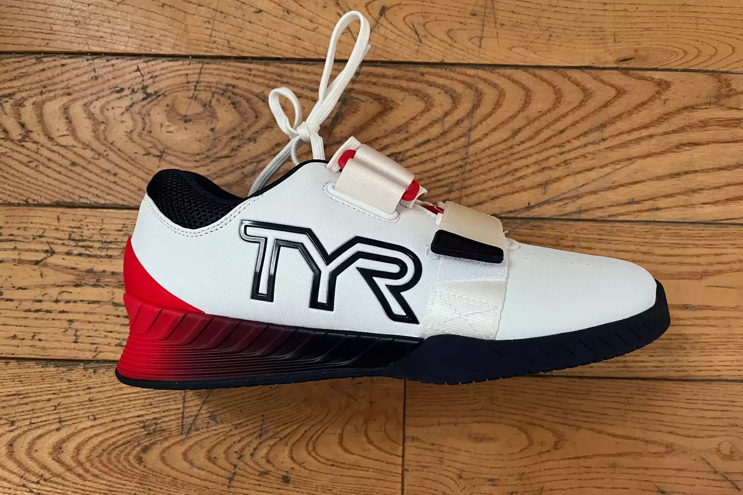 A side view of the TYR Women's L-1 Lifter Shoe showing the brand logo