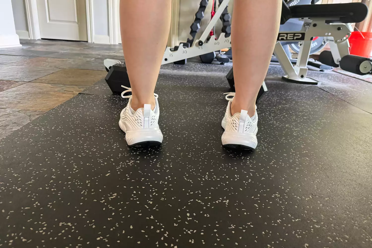 The back of a person wearing the Under Armour Women's UA Commit 4 Training Shoes