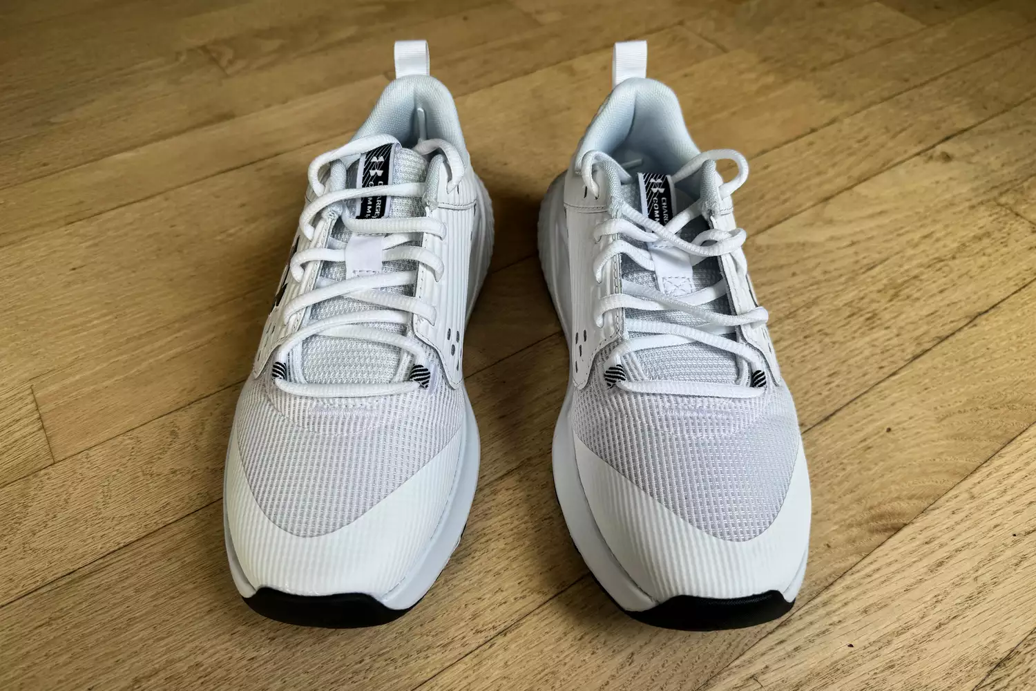 A front view of a pair of Under Armour Women's UA Commit 4 Training Shoes