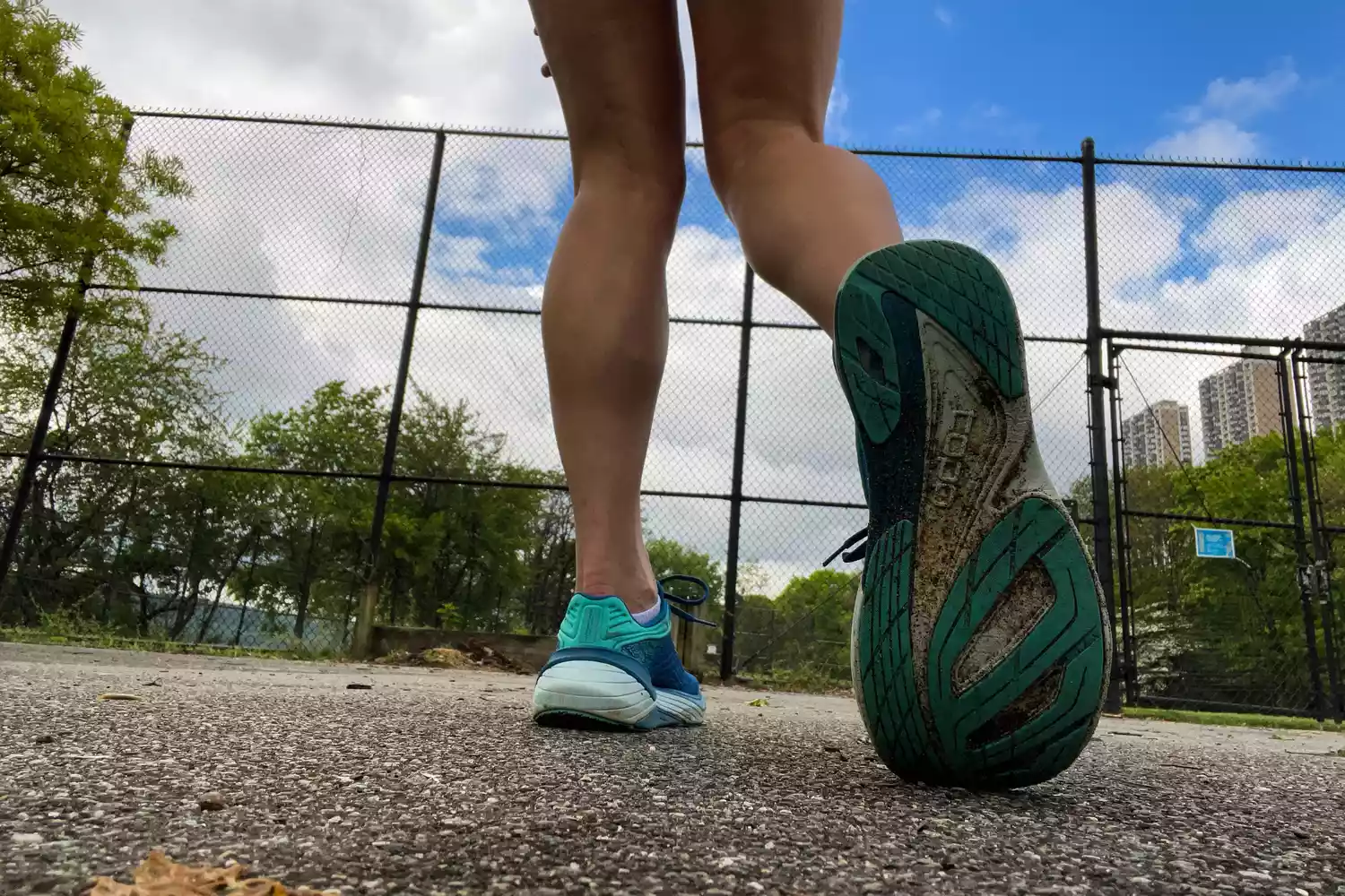 The back of the Topo Athletic Women&acirc;s Ultrafly 5 sneakers worn at a park