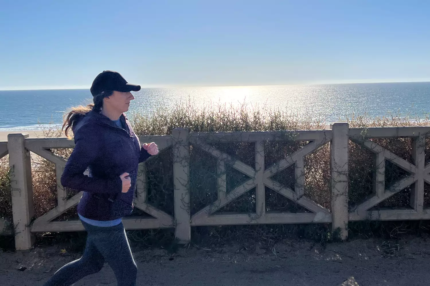 Person running in Athleta Run With It Jacket