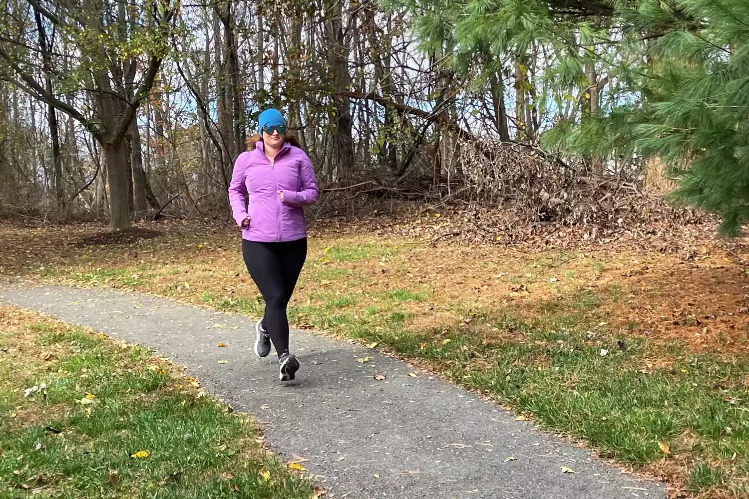 Person running outside wearing Lululemon Another Mile Jacket