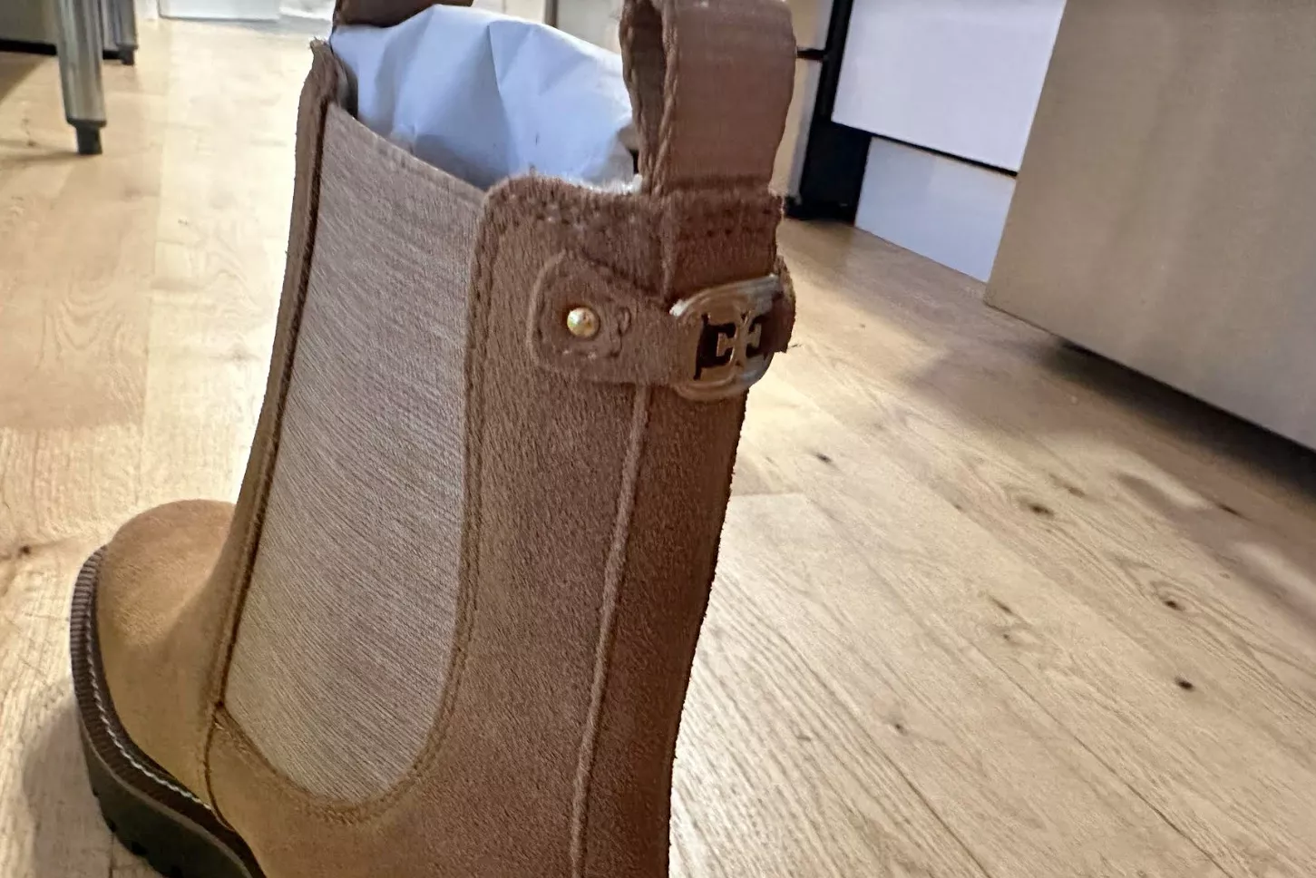 The Sam Edelman Laguna Waterproof Chelsea Boot on a wood floor