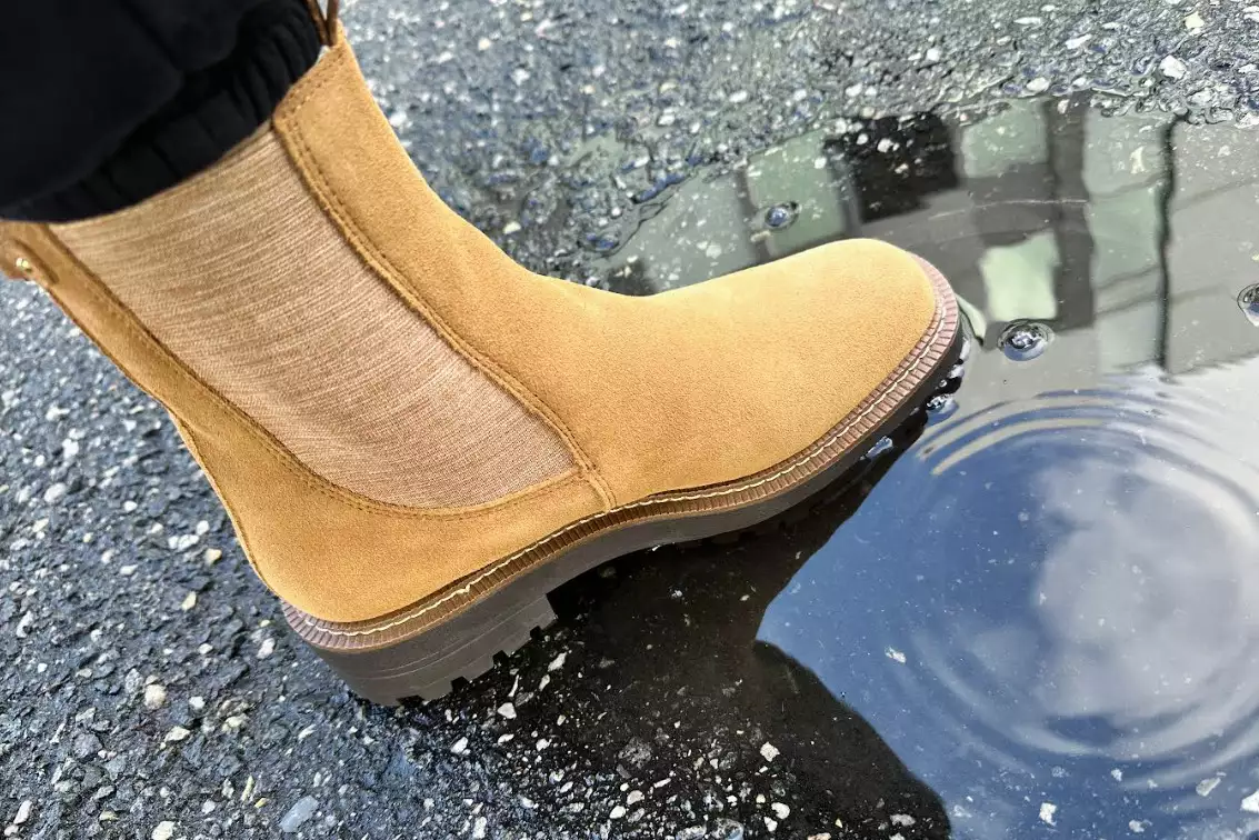 A foot in the Sam Edelman Laguna Waterproof Chelsea Boot in water