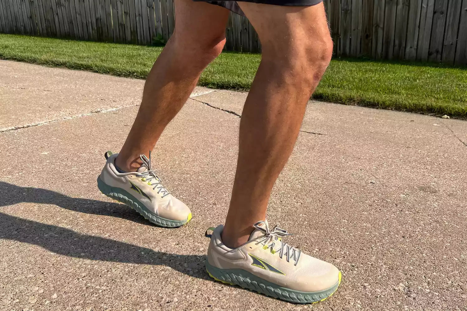 A close-up of a person walking outdoors in the Altra Outroad 2 sneakers