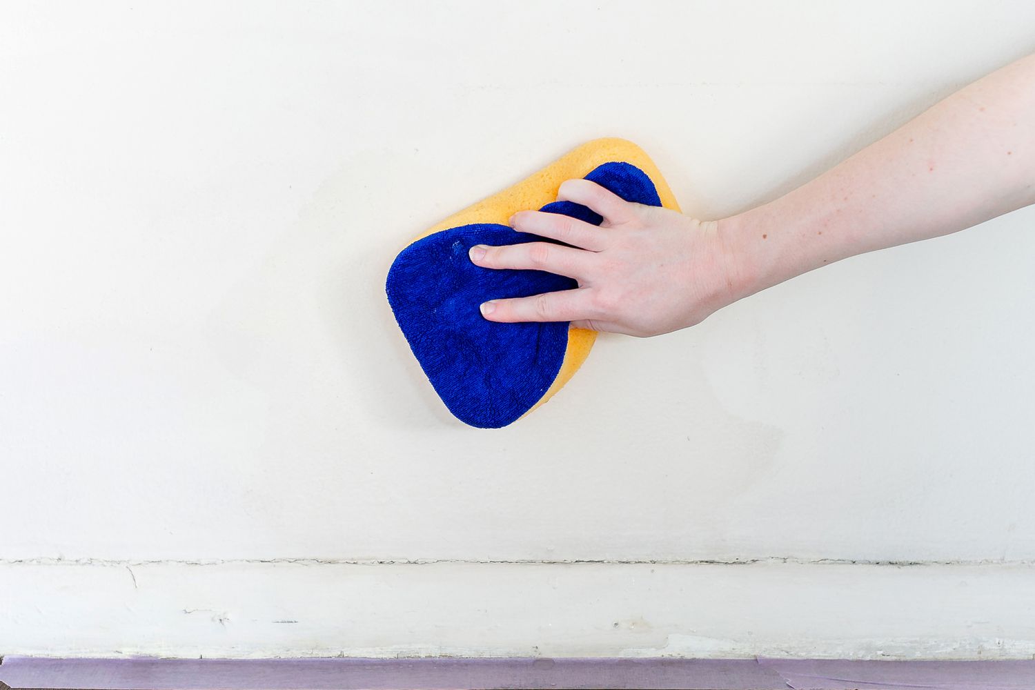 washing walls with a damp sponge