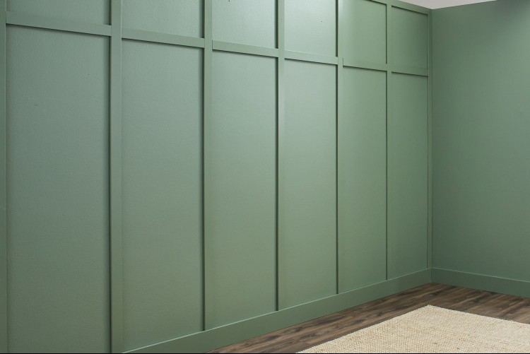 Side angle view of a wall painted with sage eggshell paint
