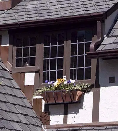 A window box with flowers planted in it.