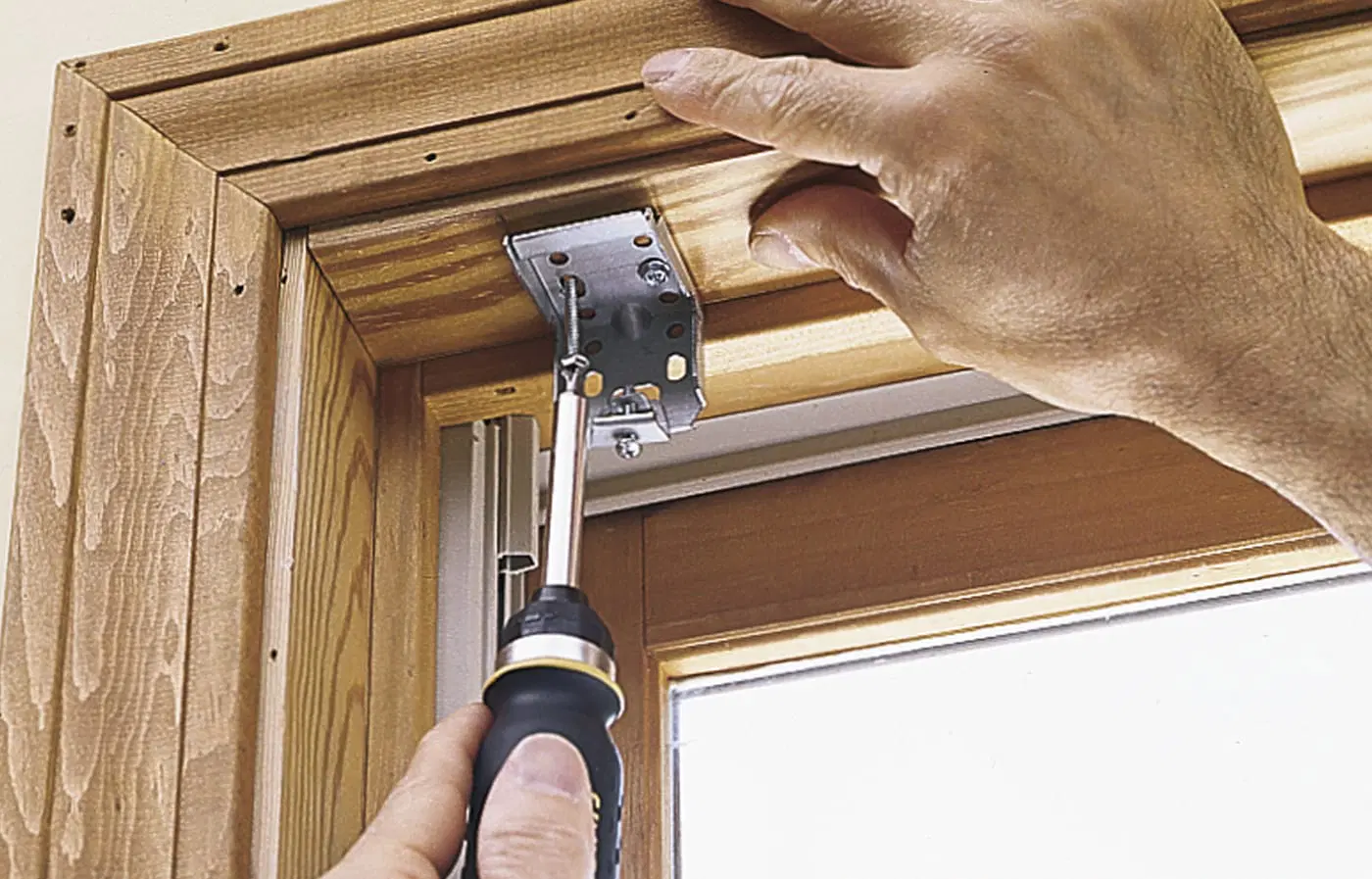 Mounting brackets for window shades being placed in a window frame.